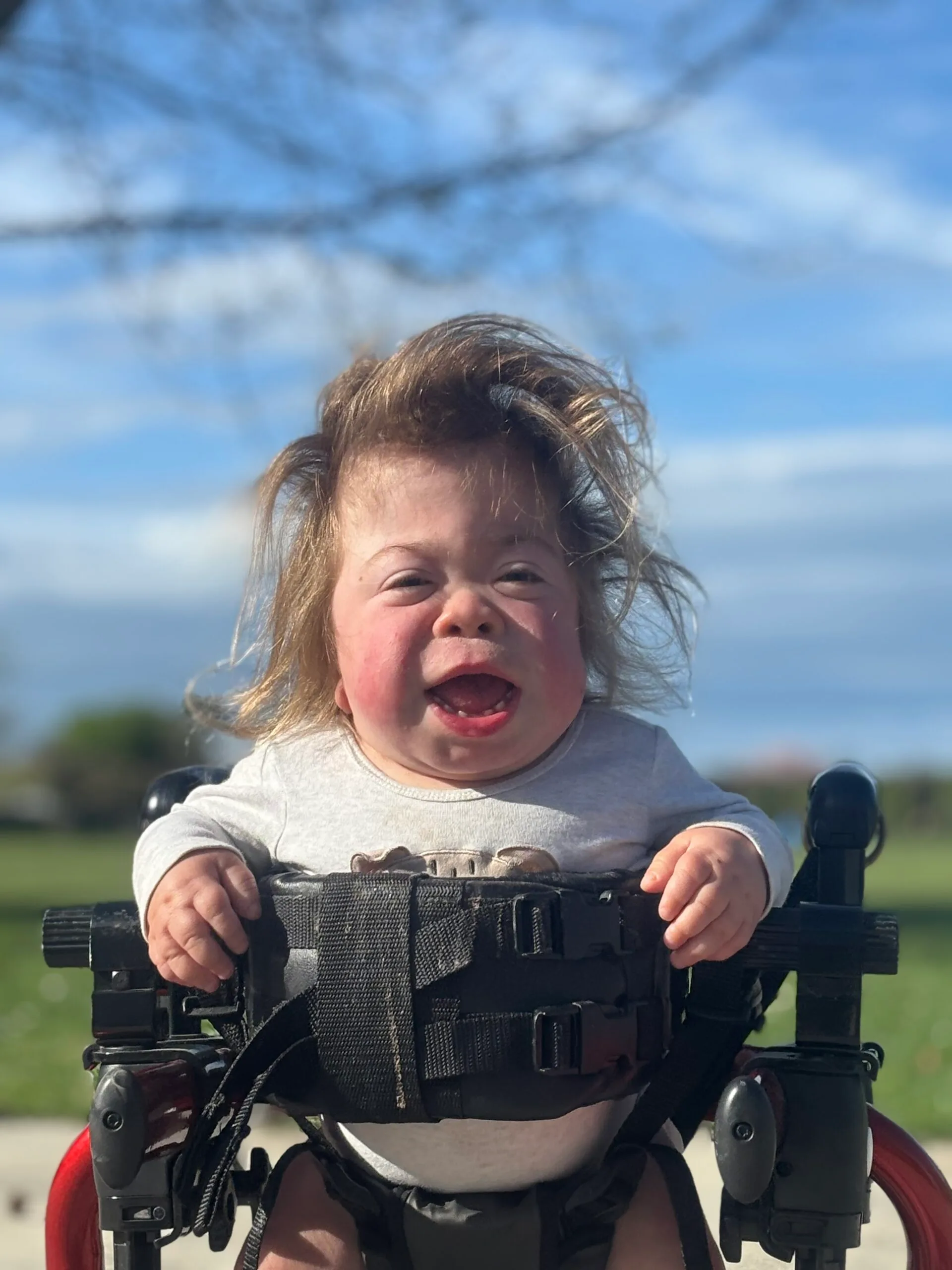 little girl in a walking frame