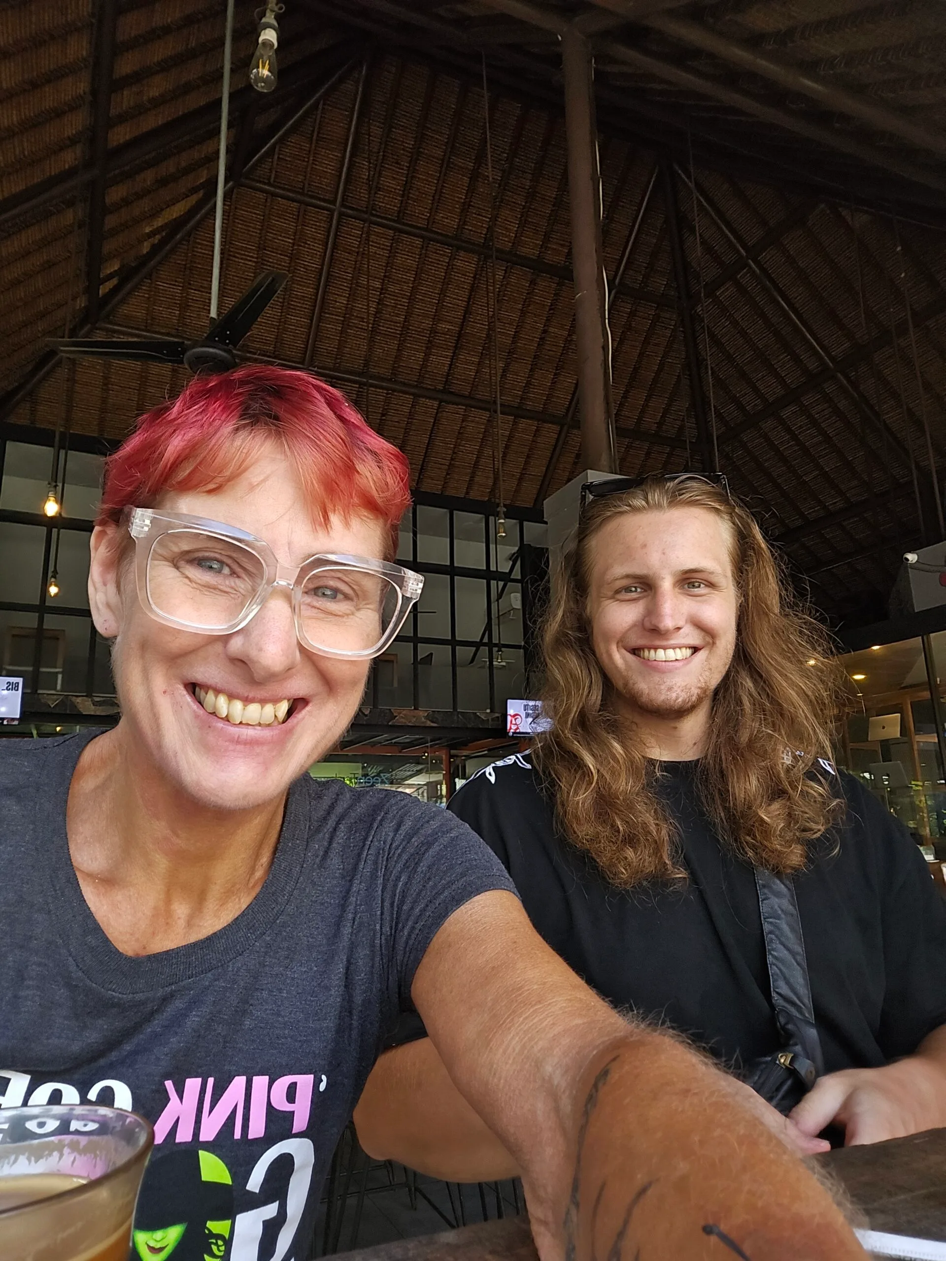 woman with red hair, son with long hair 