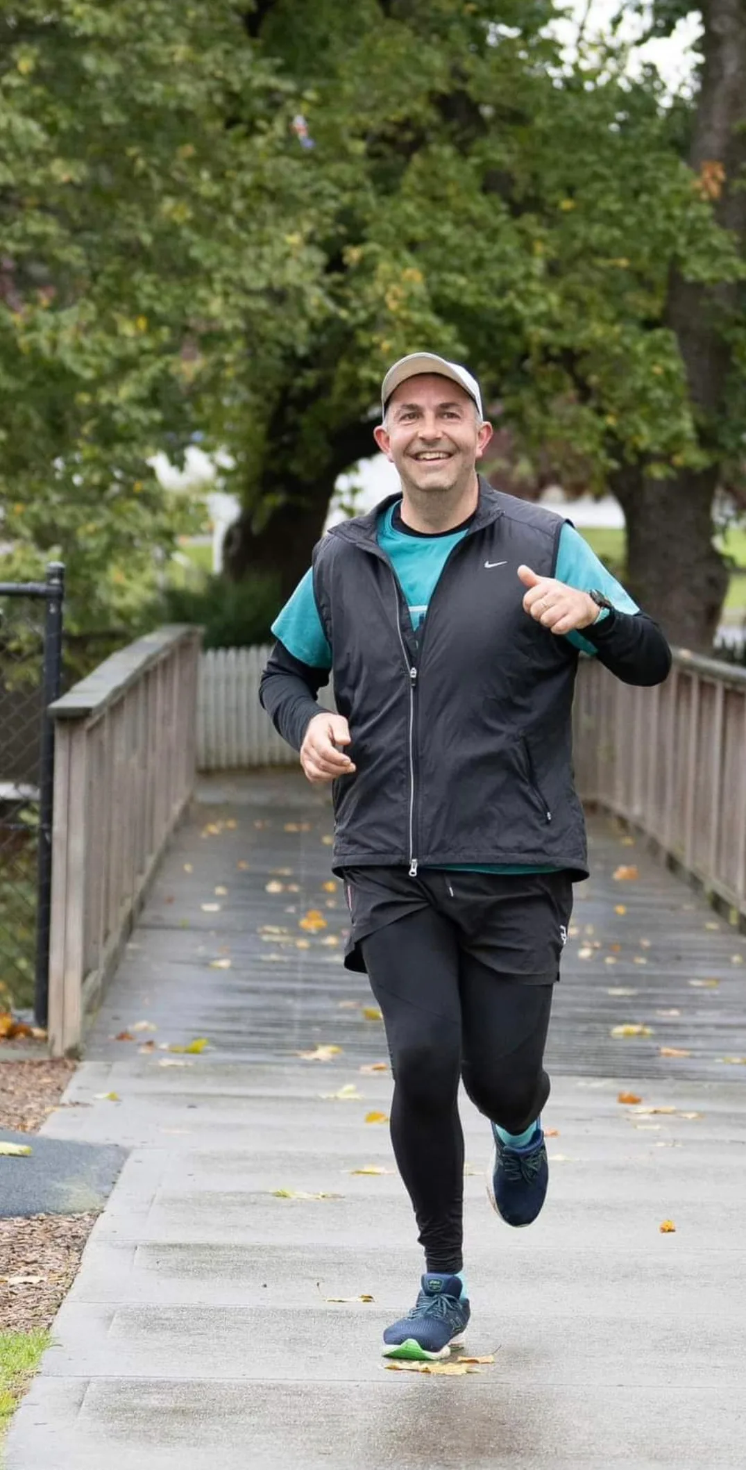 man running on bridge
