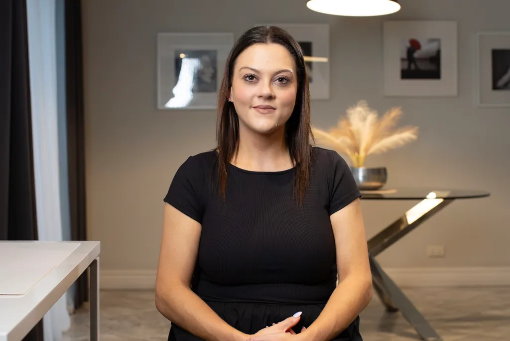 Image of woman wearing black top