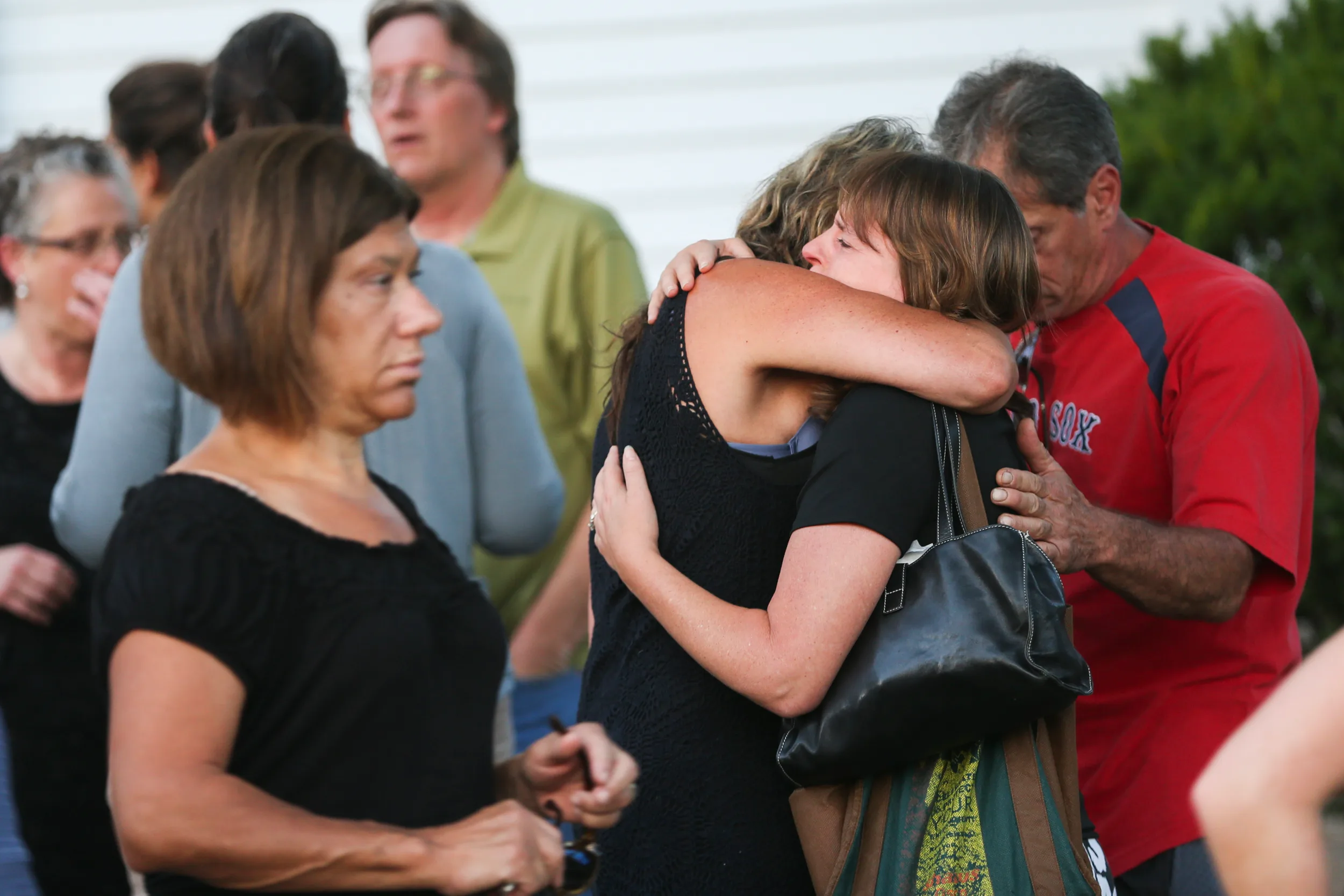 Crowds gather after a vigil for Vanessa Marcotte