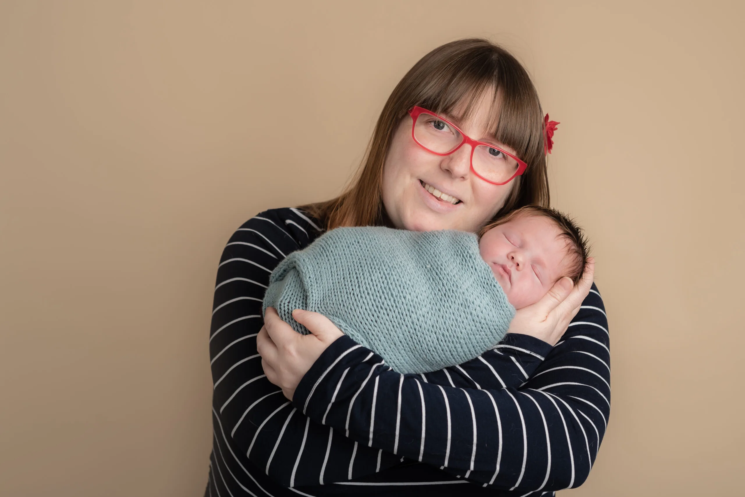 a woman holding small baby