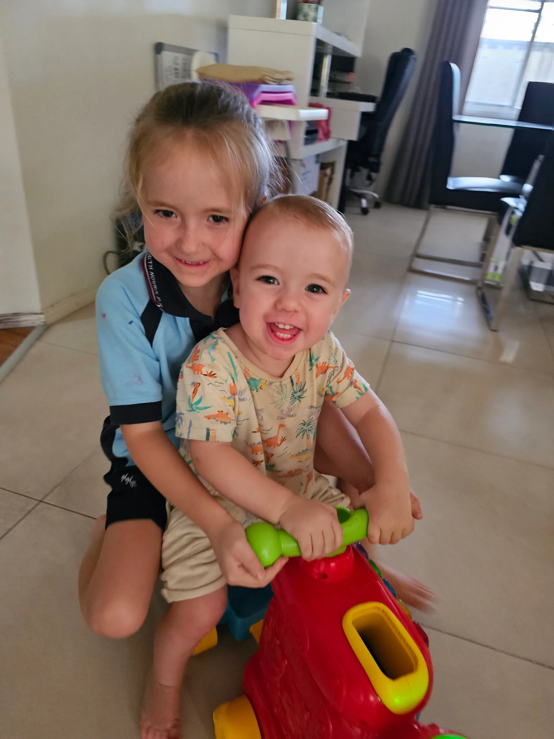 sister and brother on trike