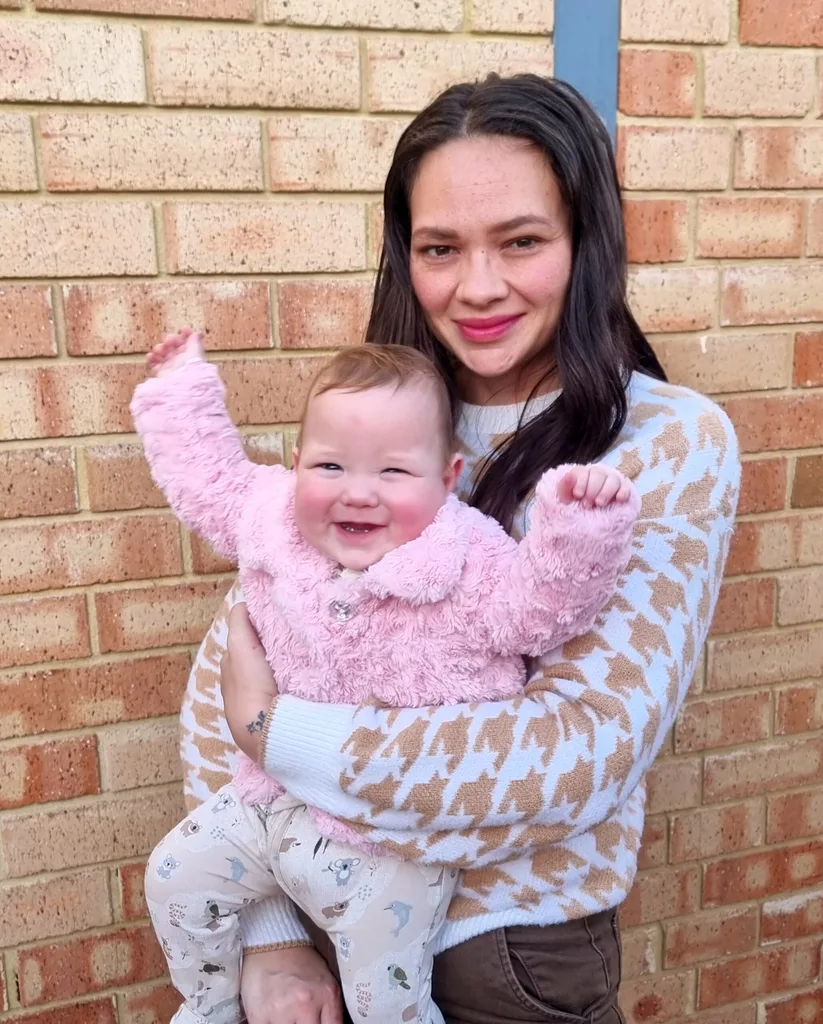 Image of woman holding toddler