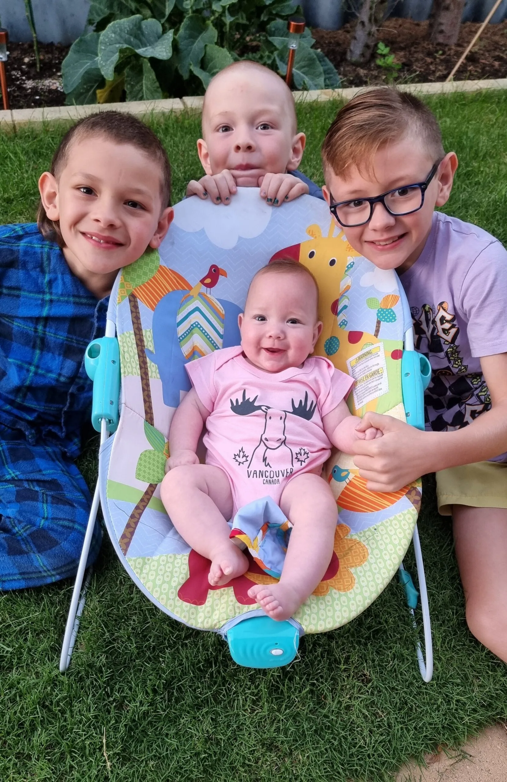 Image of three brothers and newborn sister