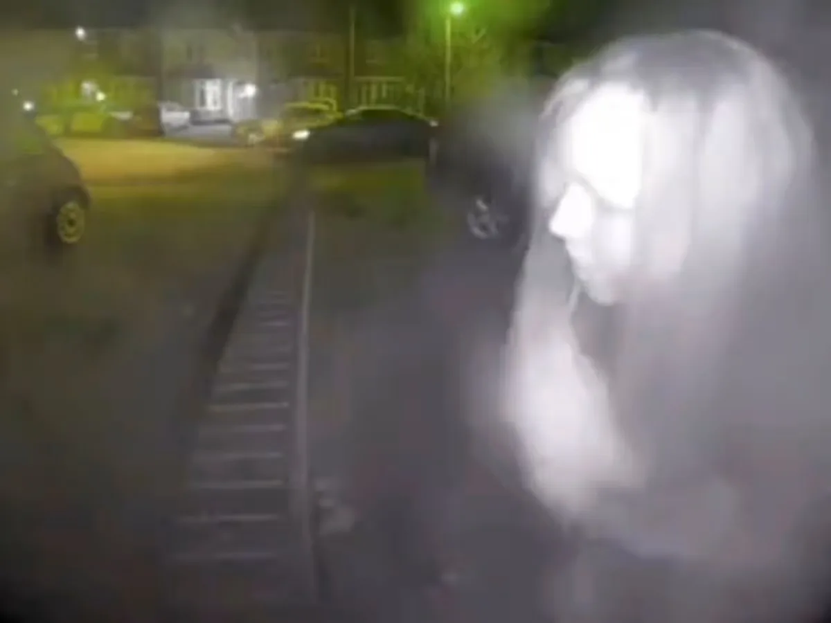 Image of woman on door bell camera