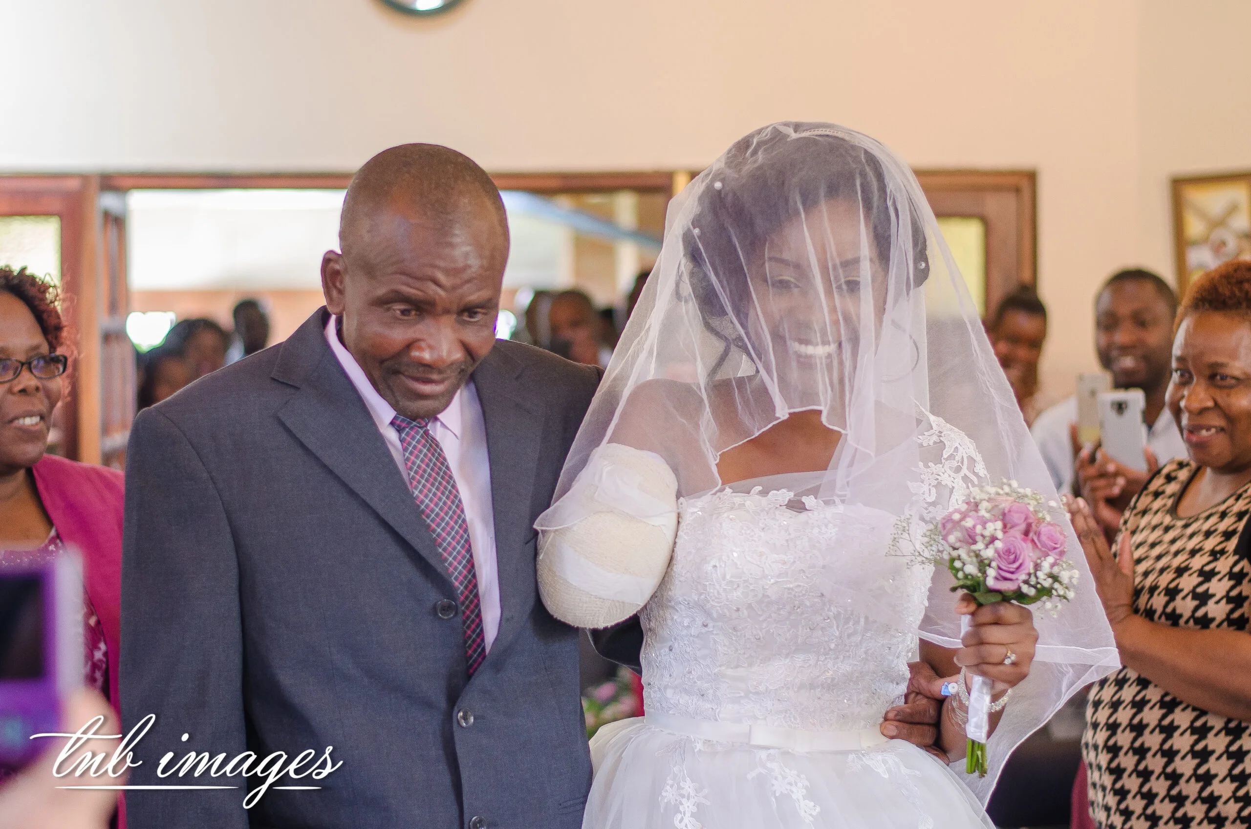 bride and dad walking down the aisle