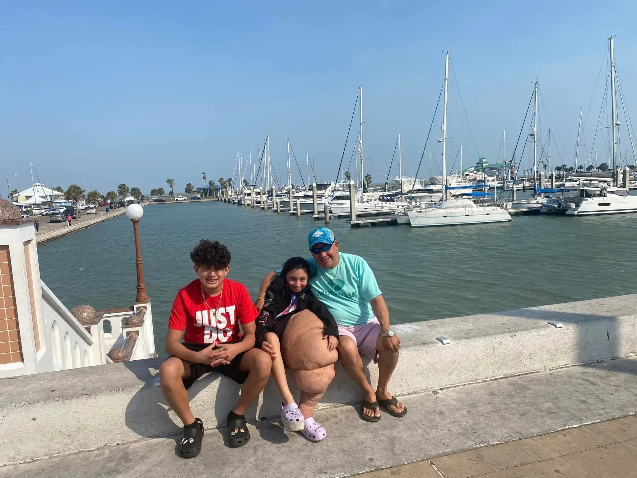 Image of family sitting at waterfront