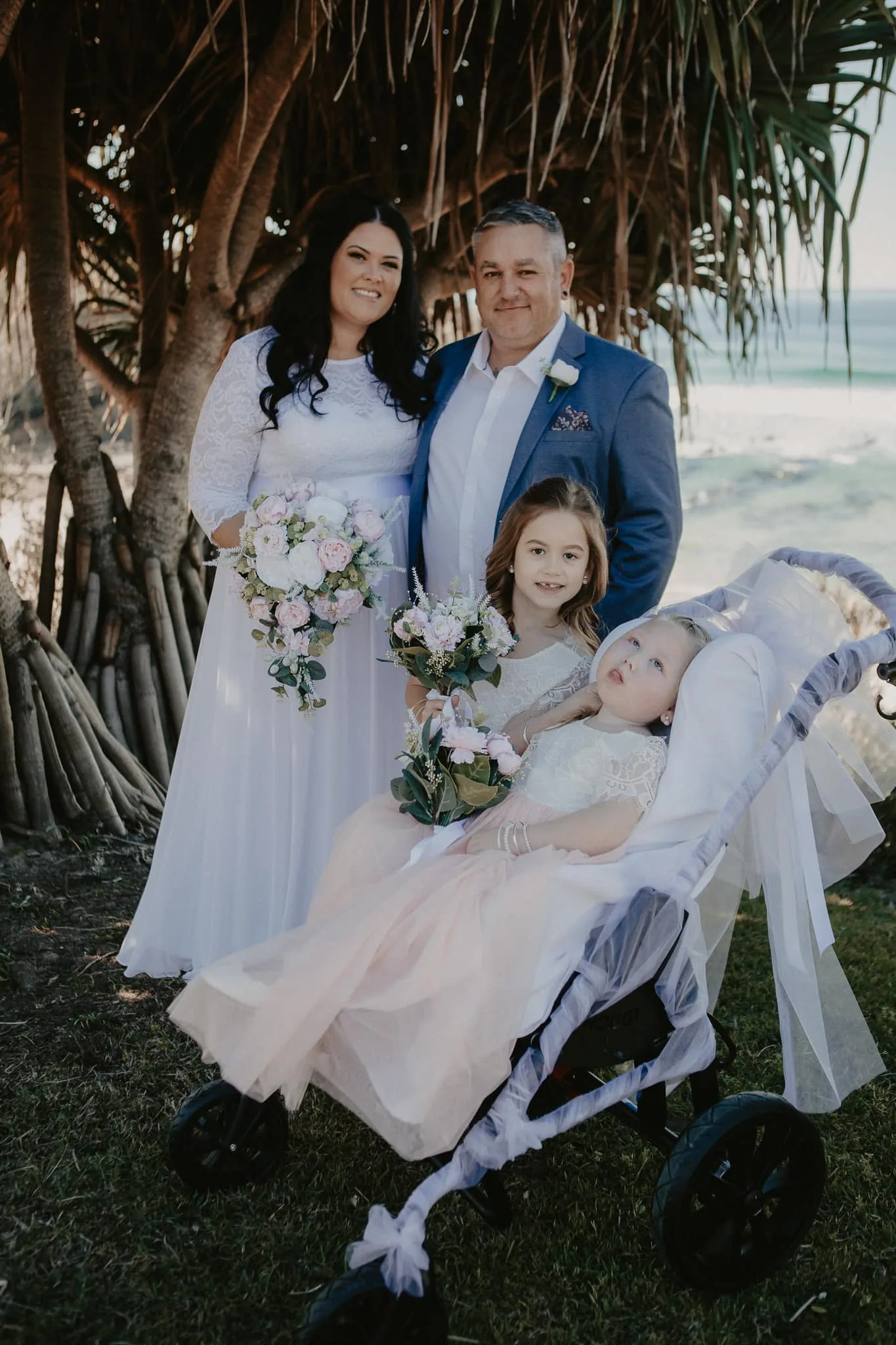 Image of bride and groom and flowergirls