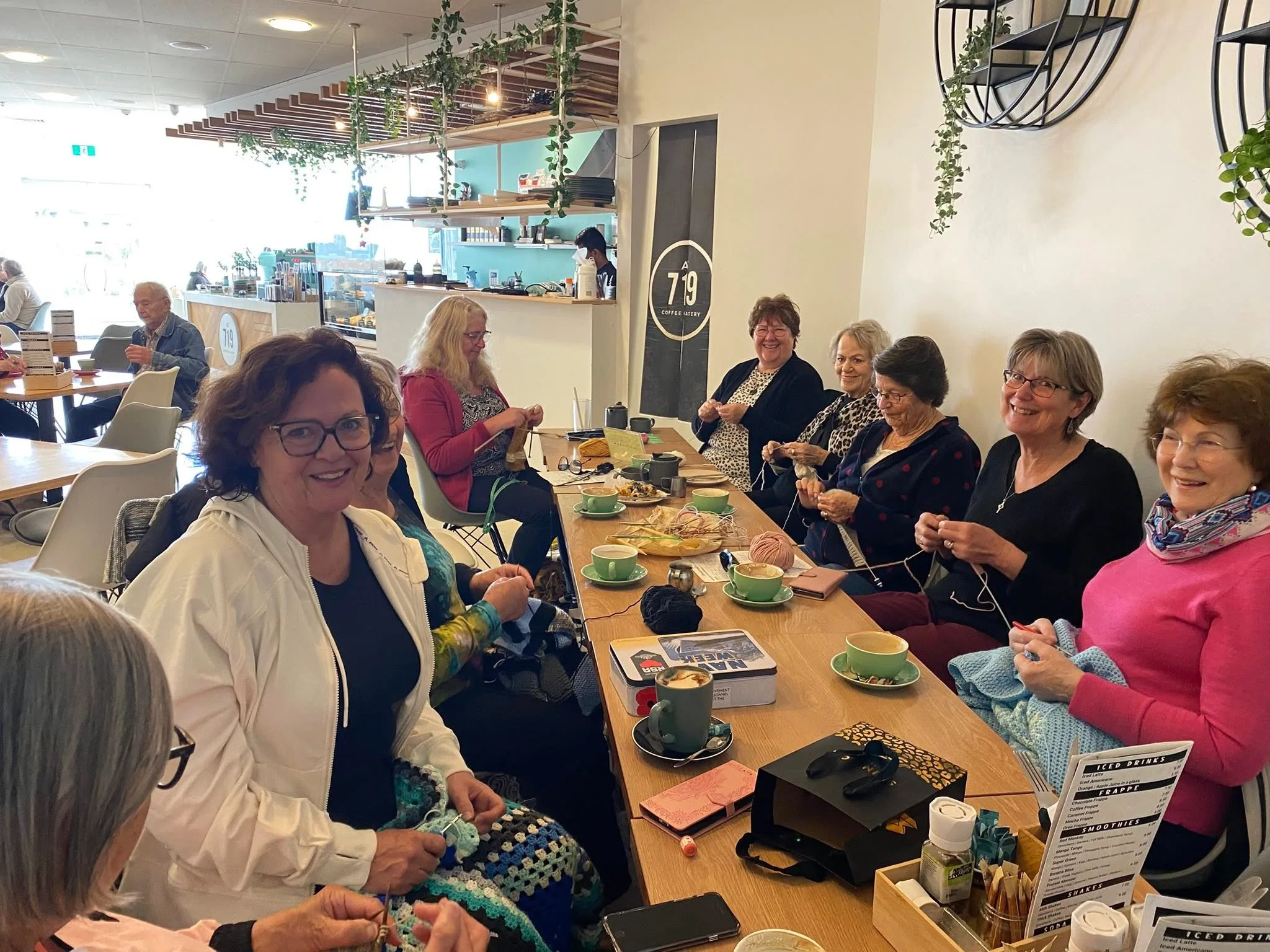 women knitting over coffee