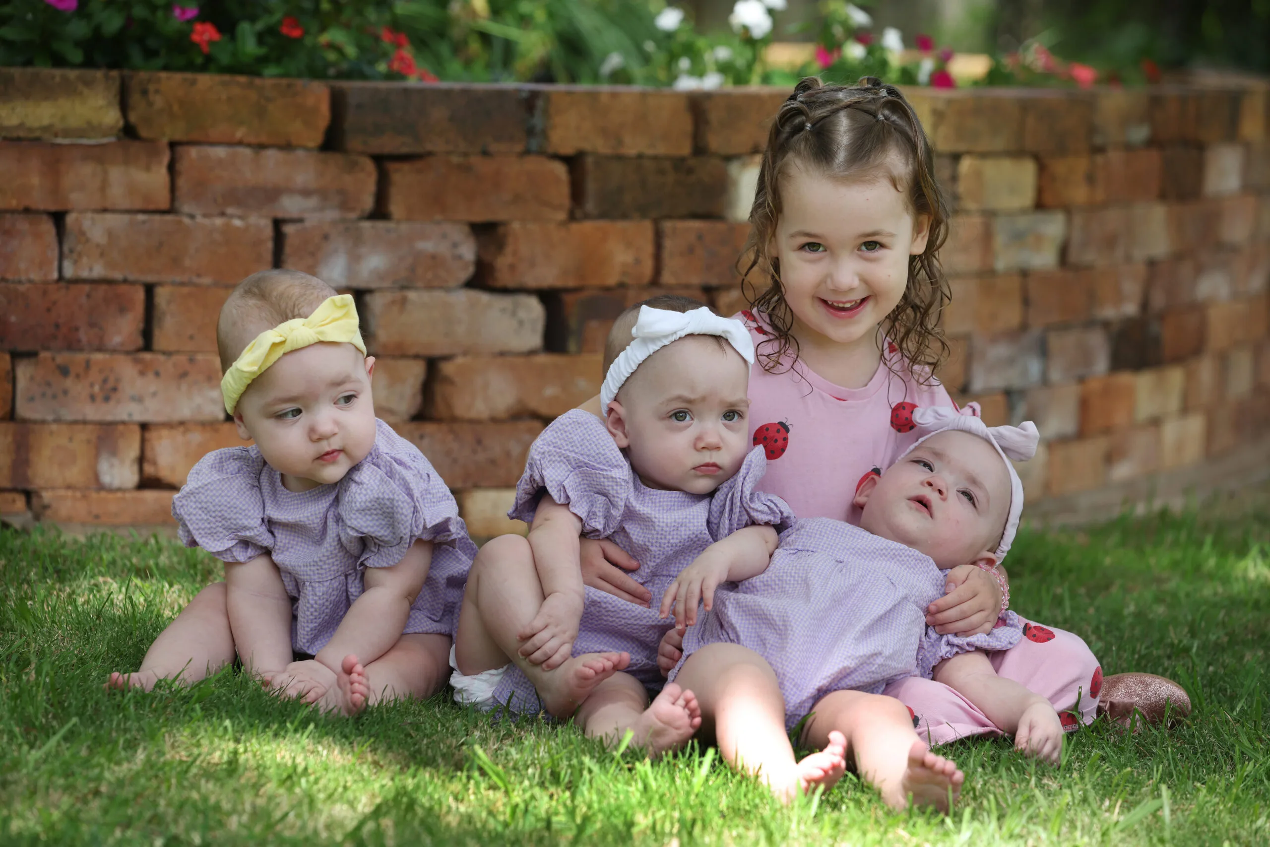 three children on the grass 