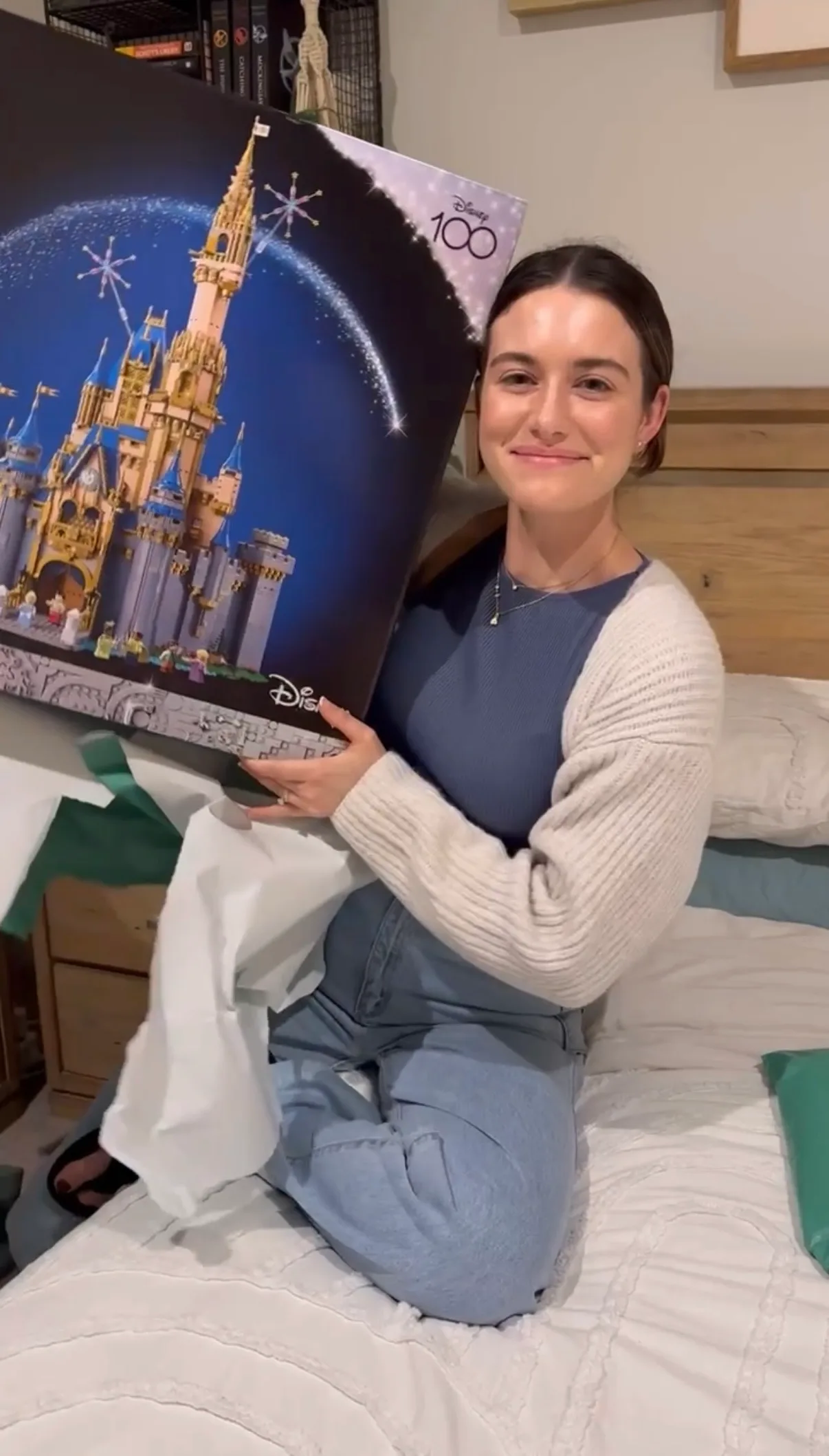 woman unwrapping lego gift