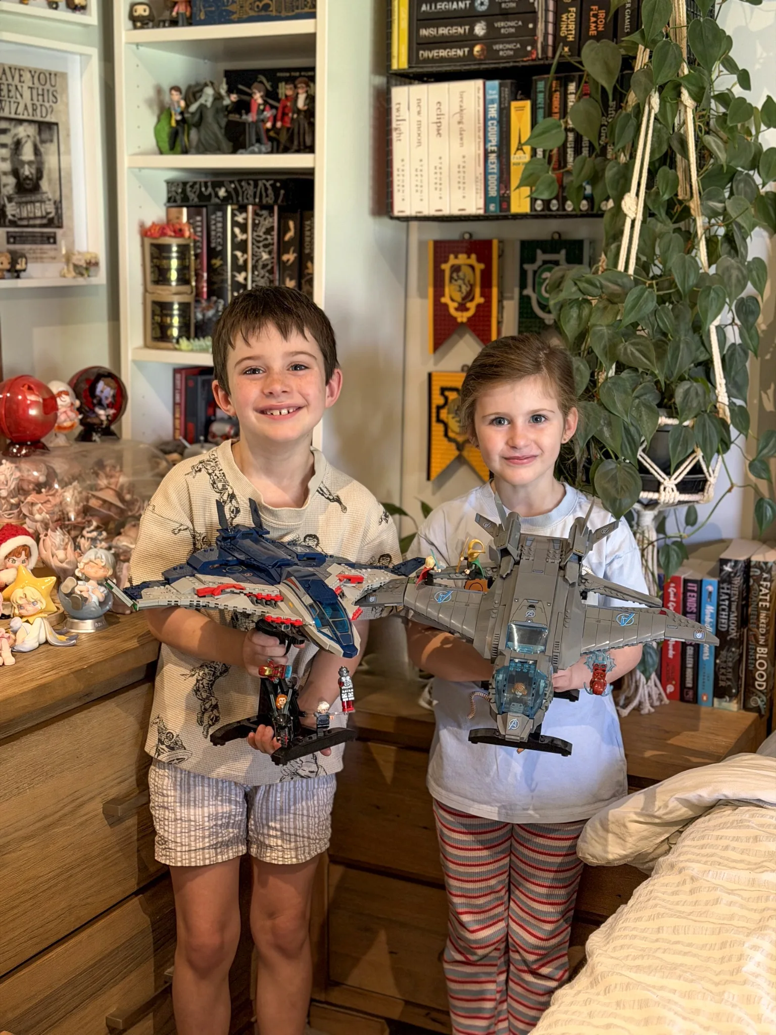 two kids holding lego