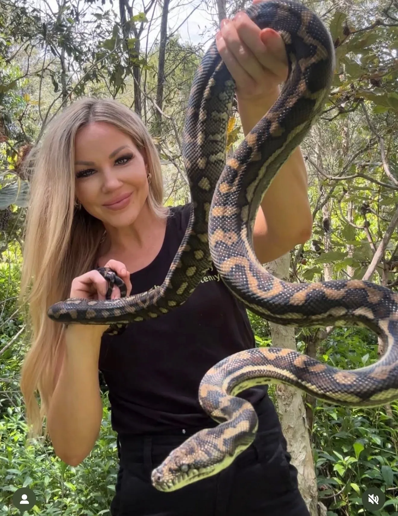 woman holding snake