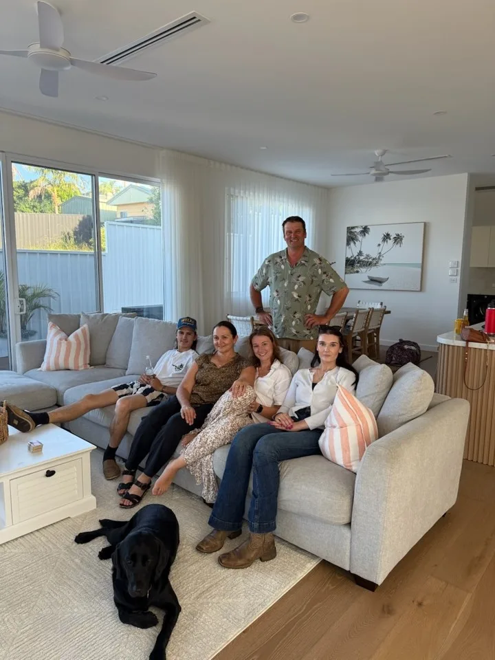 family sitting on couch