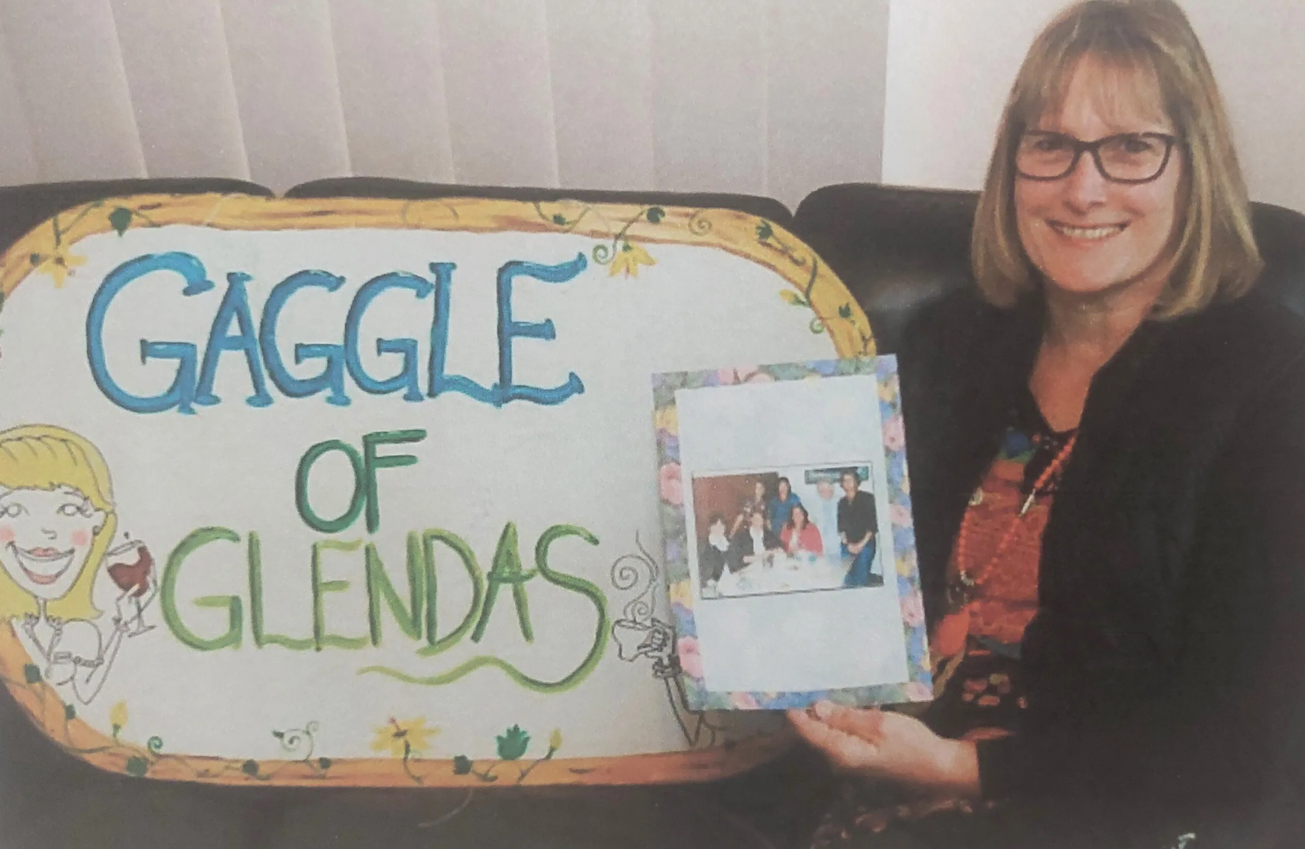 lady next to gaggle of glendas sign
