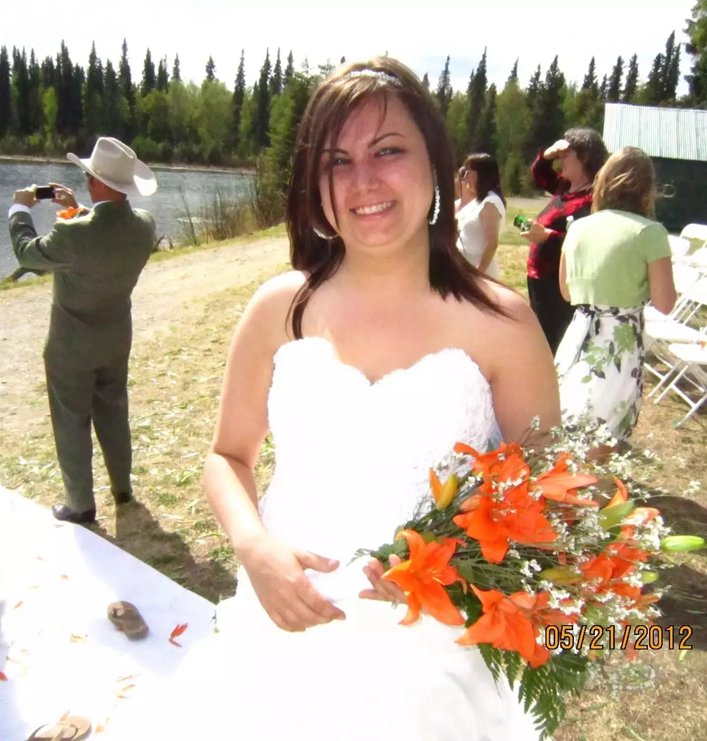 Image of woman on wedding day with orange flowers