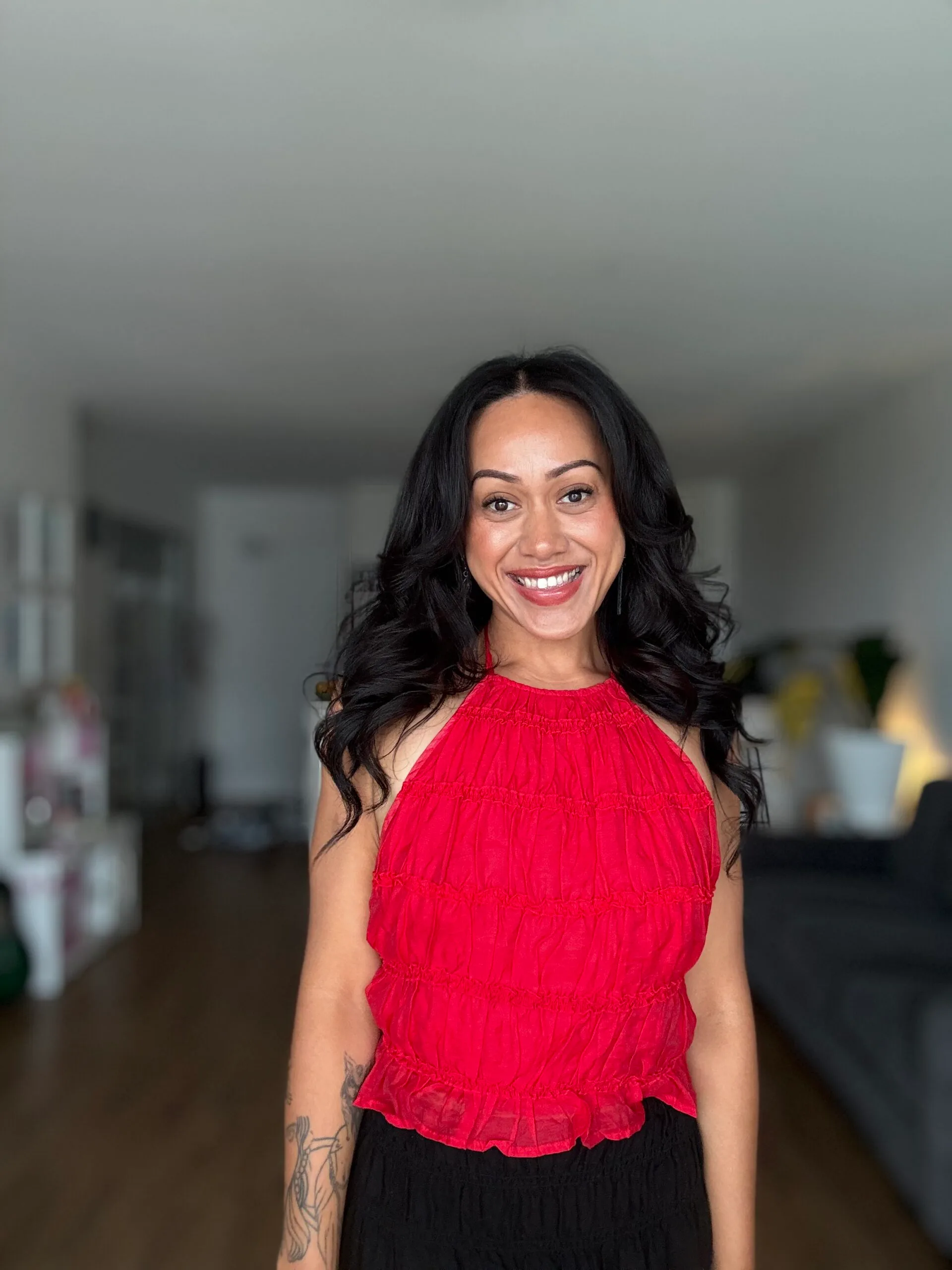 woman smiling in red top