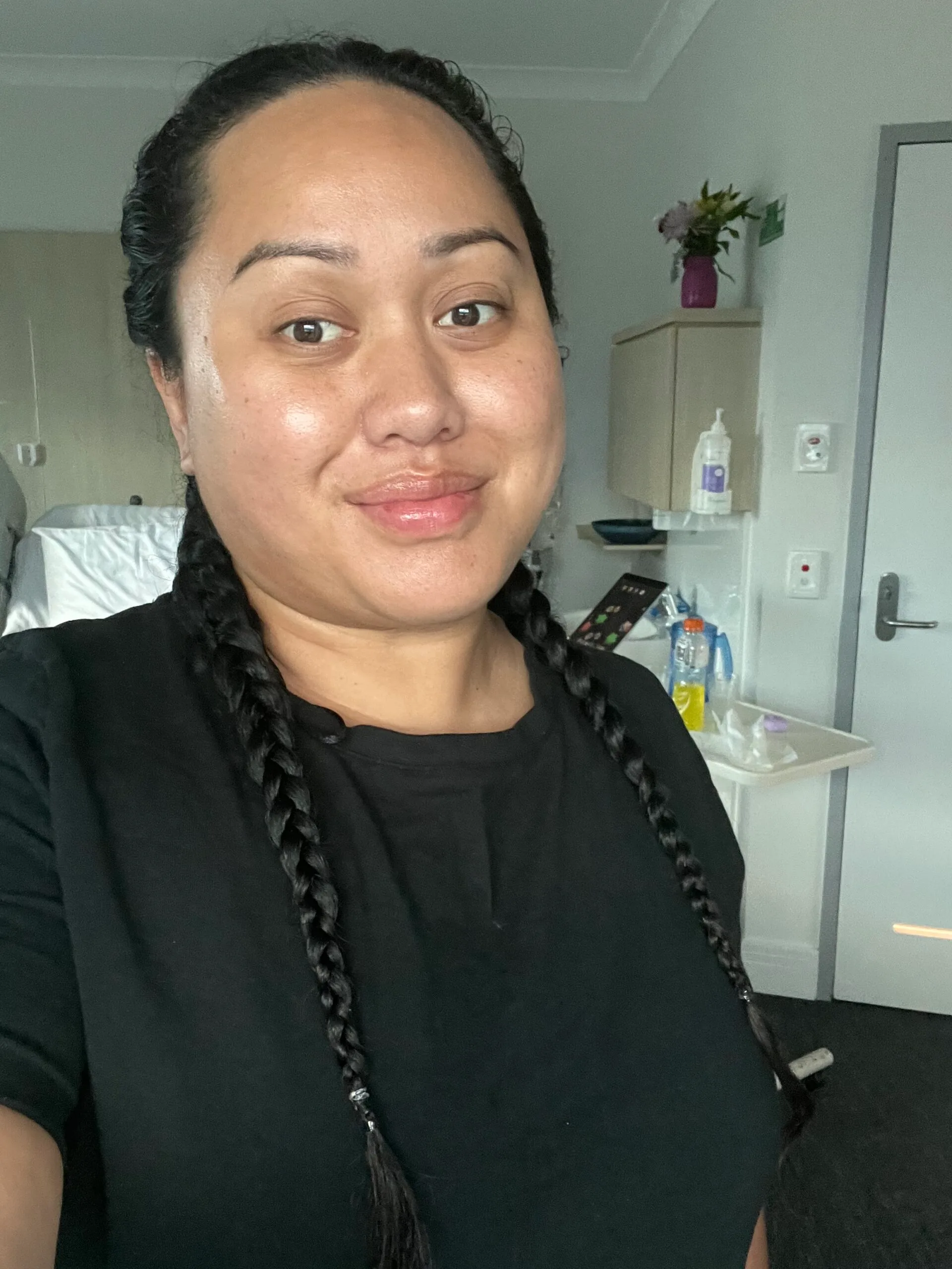 woman in black tshirt with braids