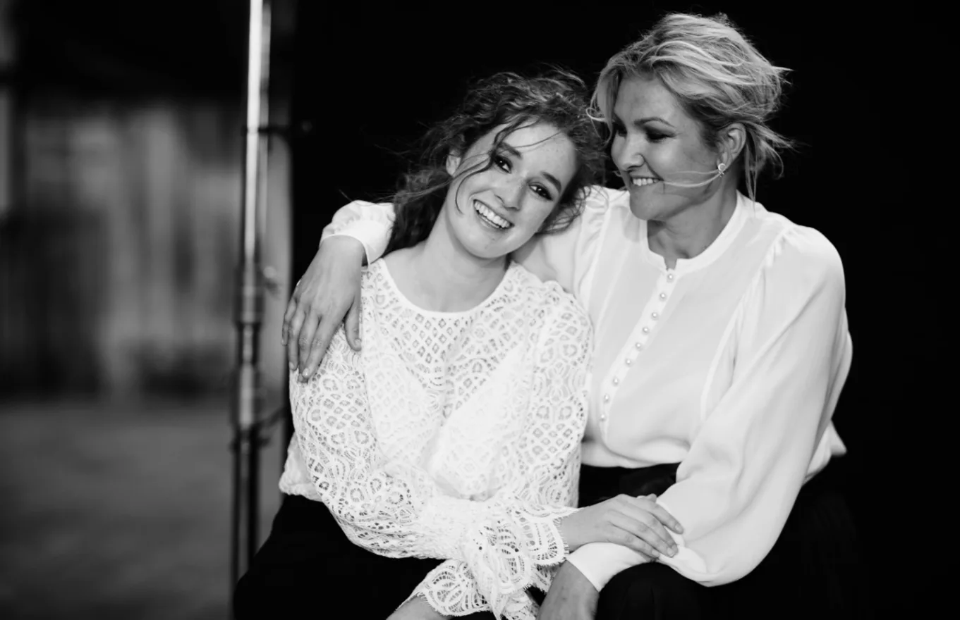 Image of two women wearing white shirt