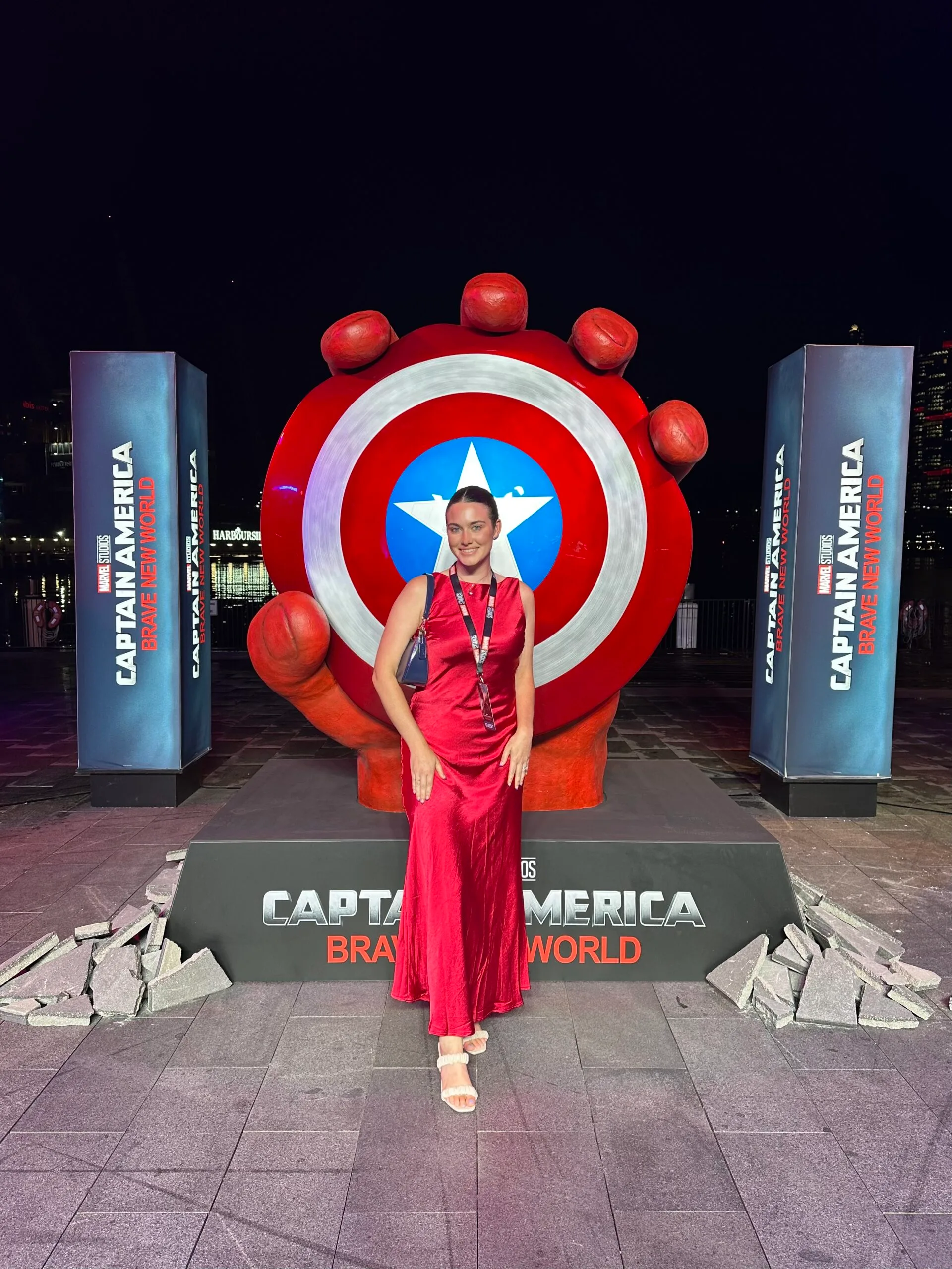 woman at marvel movie premier in red dress