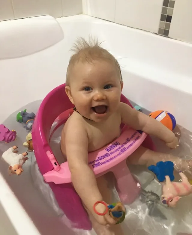 Image of toddler smiling in the bath