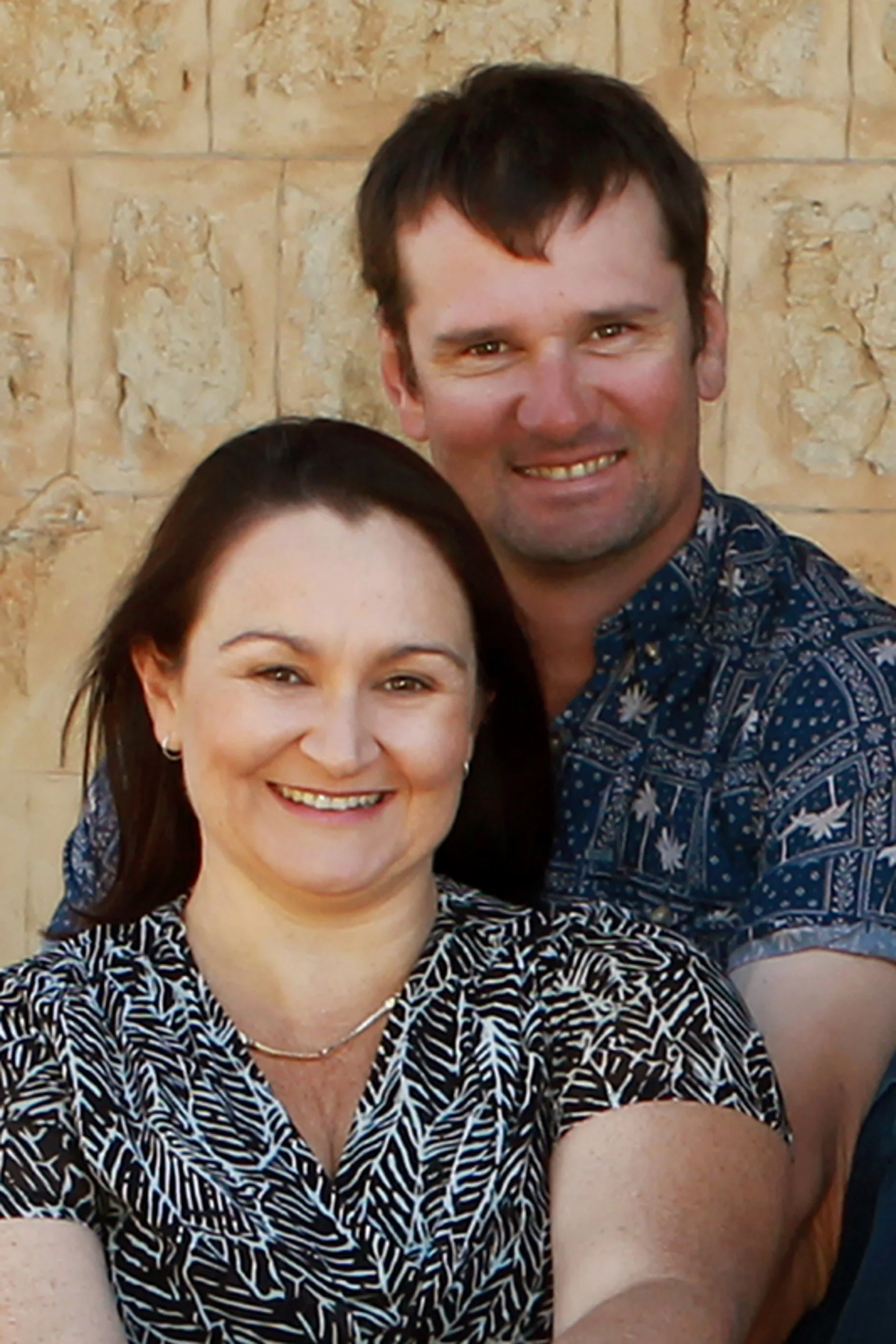 woman and husband smiling at camera