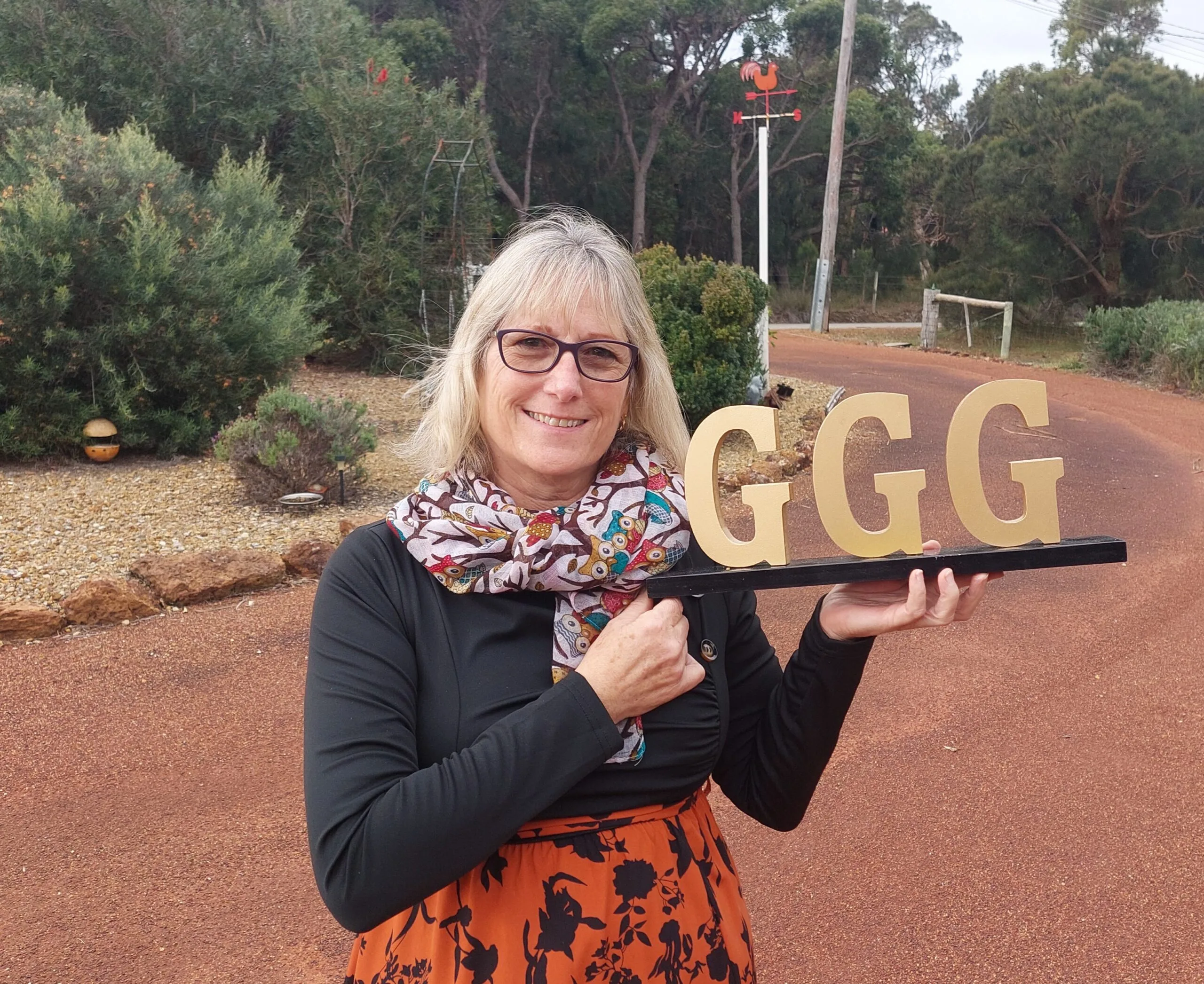 woman holding GGG sign