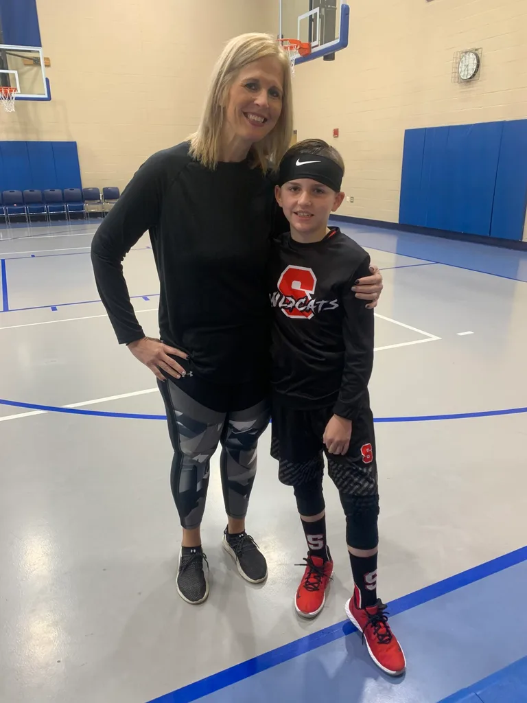 Image of mother and son at basketball game