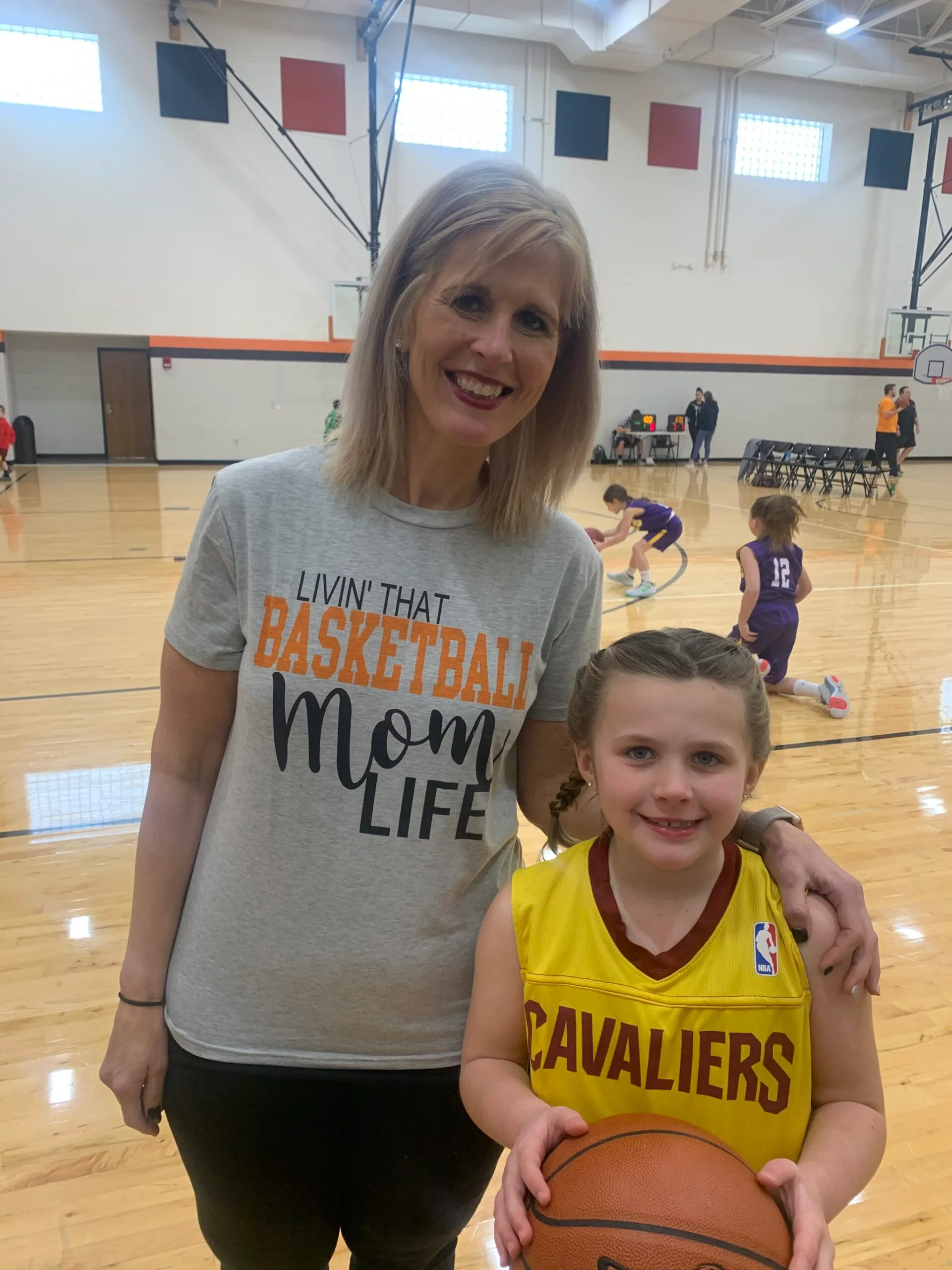 Image of mother and daughter at basketball