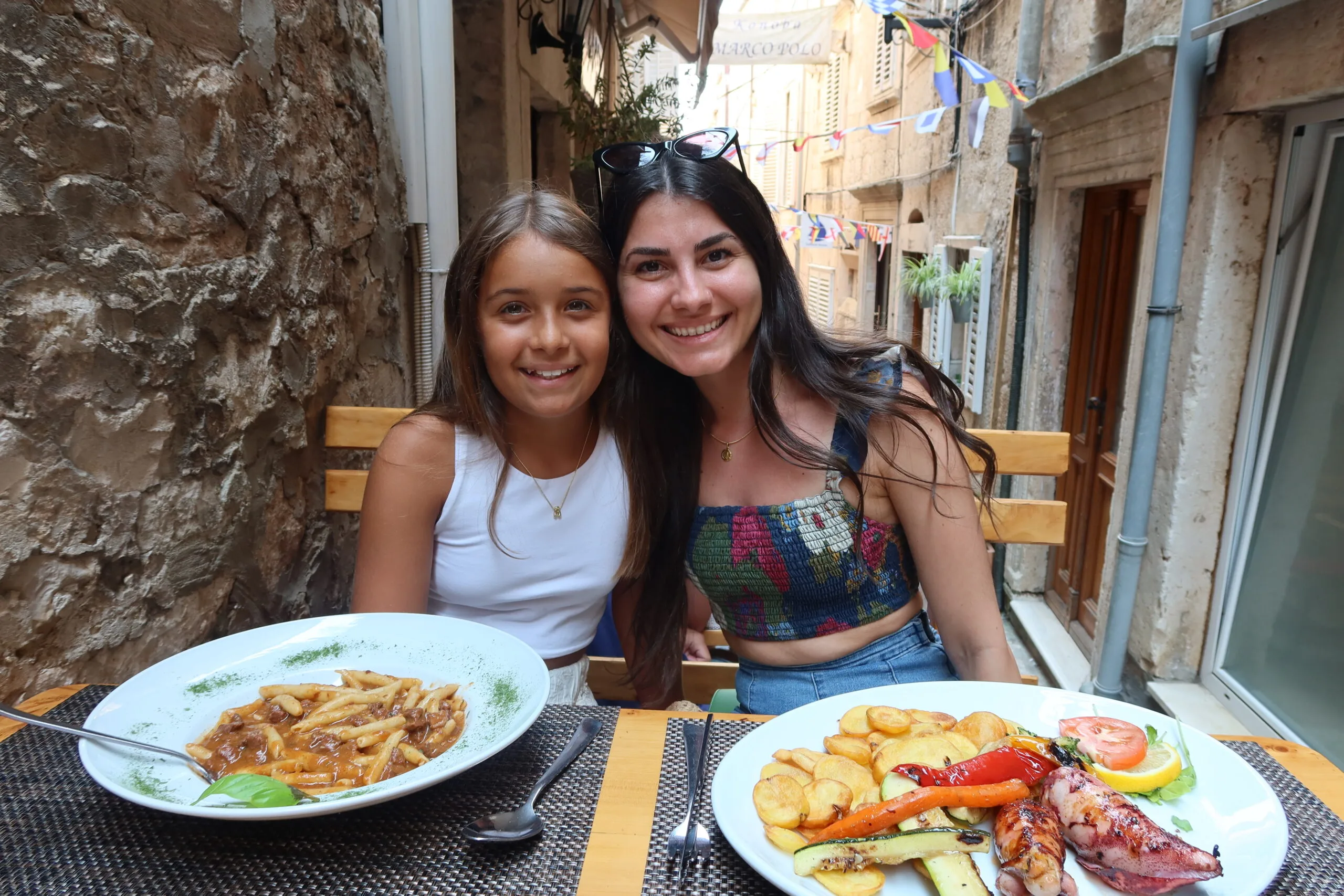 Image of two girls at lunch in korcula