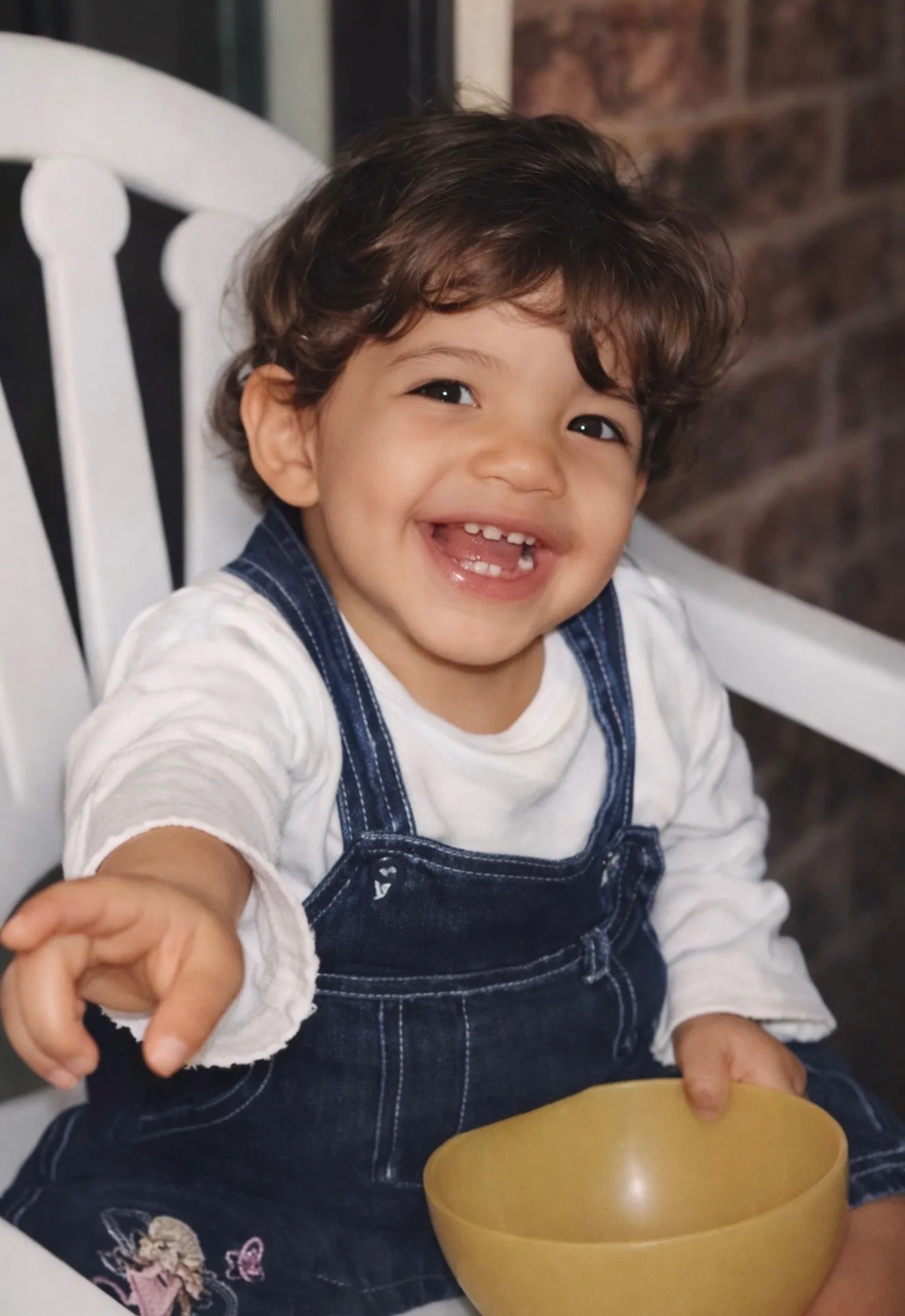 toddler in overalls 