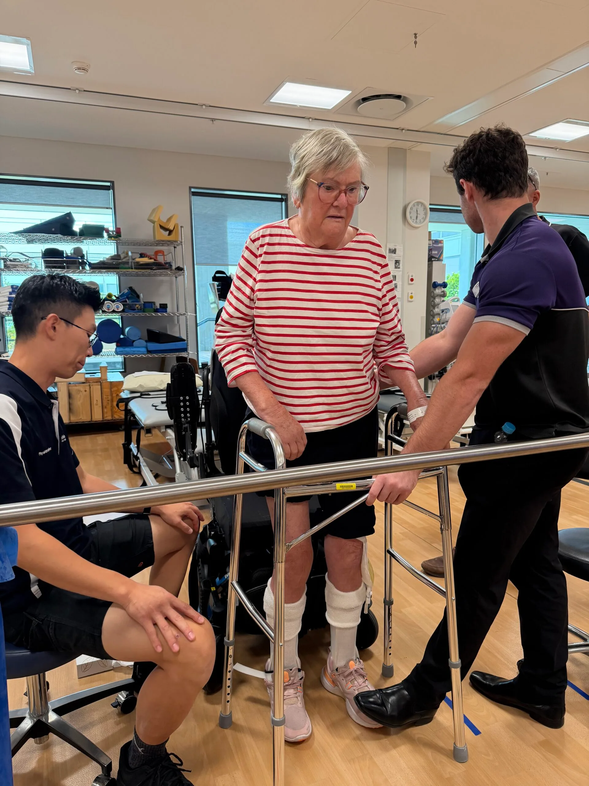 woman in striped shirt doing hospital rehab