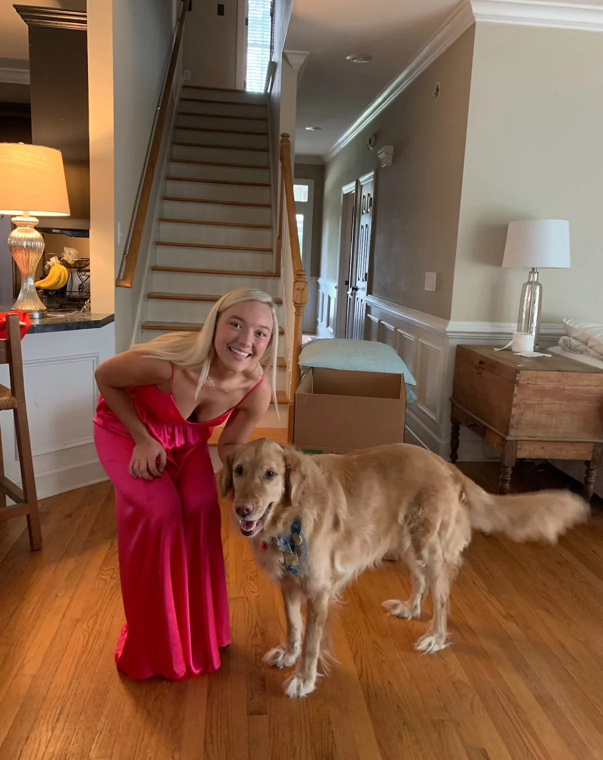 woman in pink dress with dog