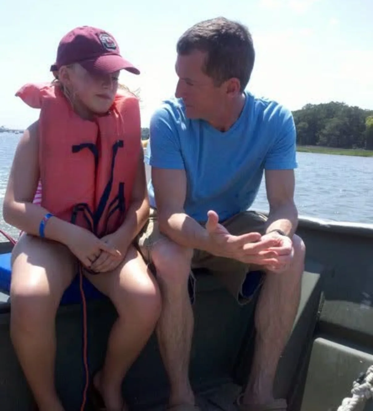 father and daughter on fishing boat
