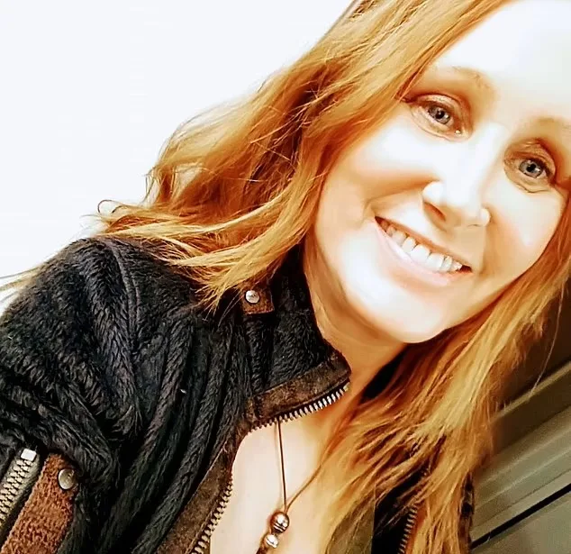 woman smiles at camera selfie 