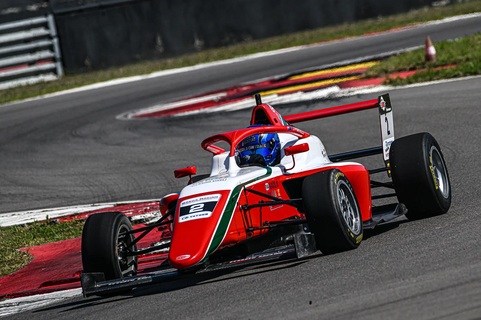 Image of young girl driving race car