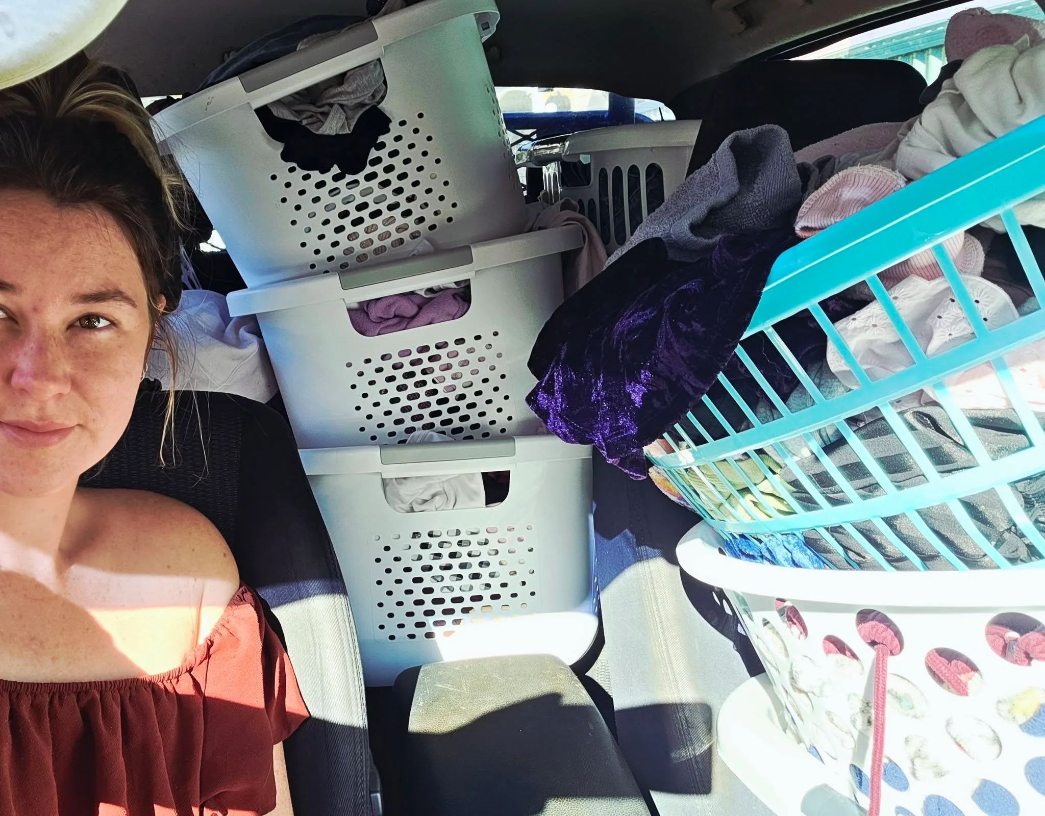 clothes in baskets in car