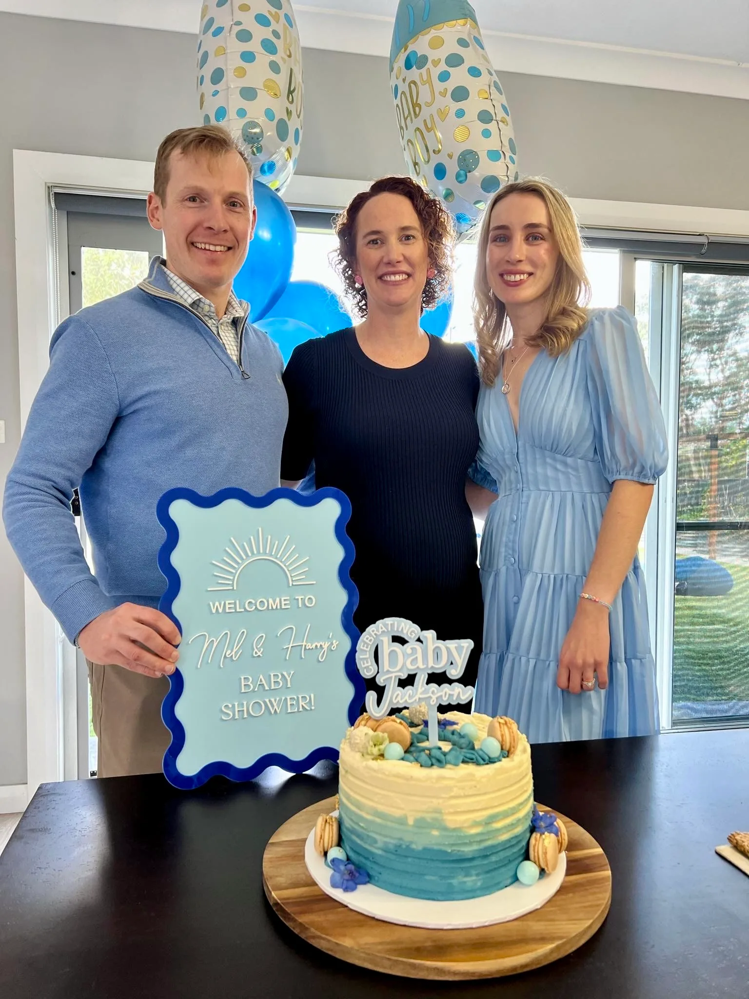 Image of parents and surrogate at baby shower
