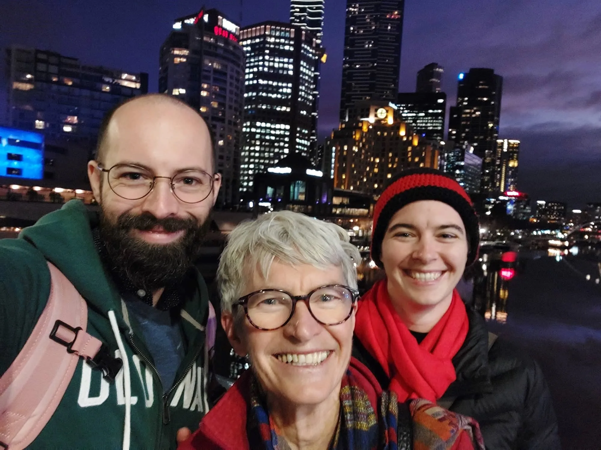 family seflie outside at night