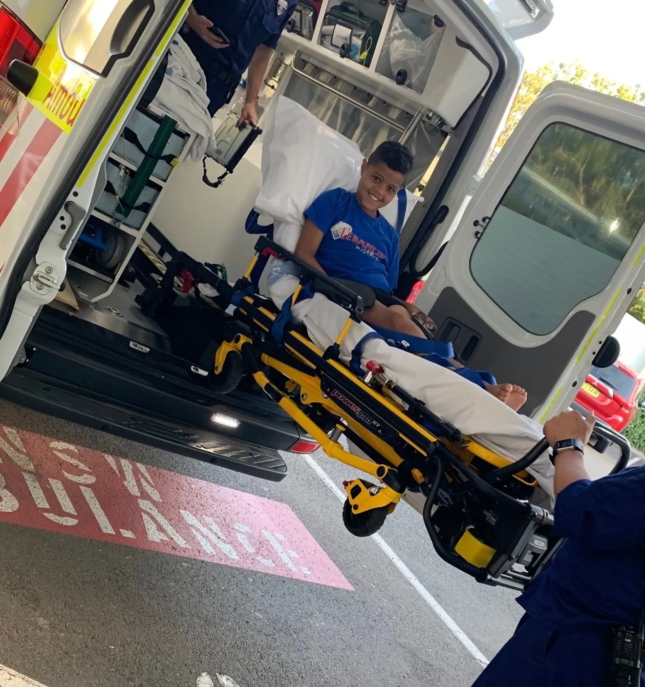 young boy loaded into ambulance 
