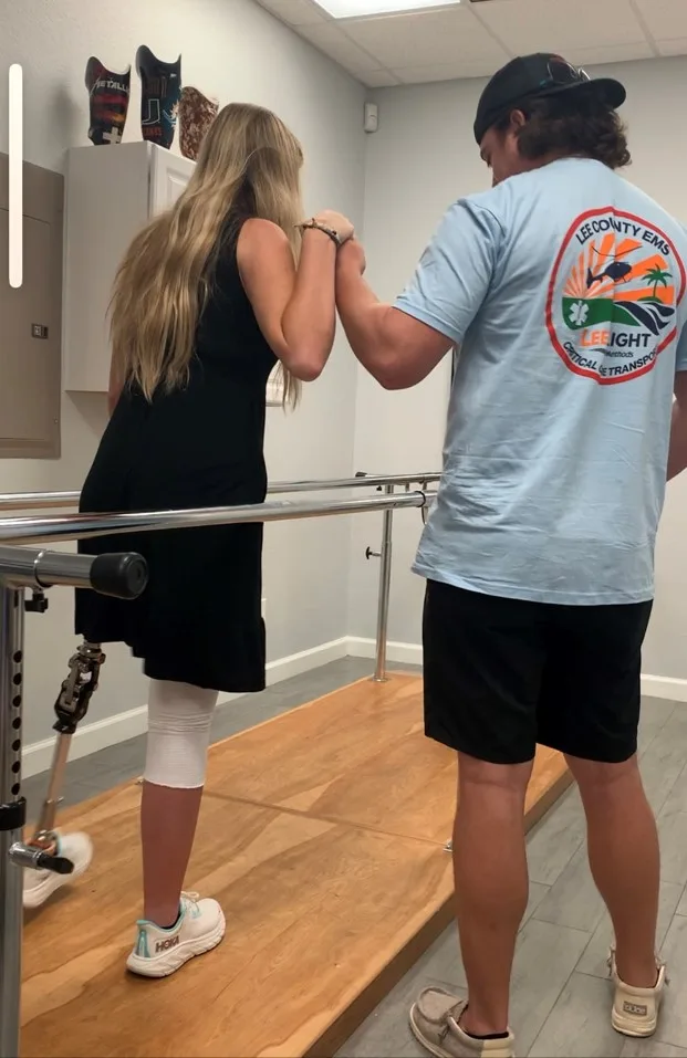 Image of woman holding boyfriends hand learning to walk