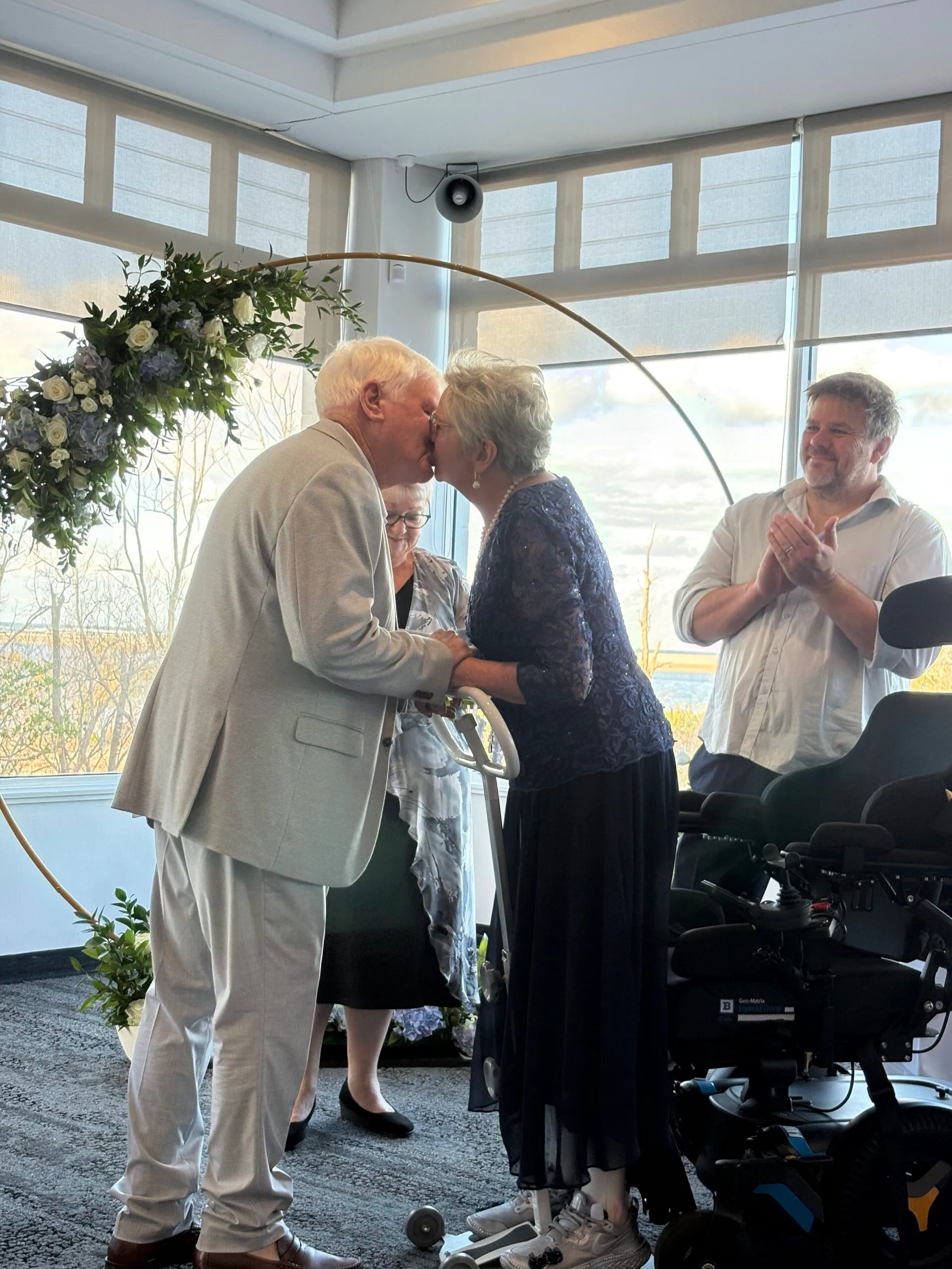 couple kiss on wedding day