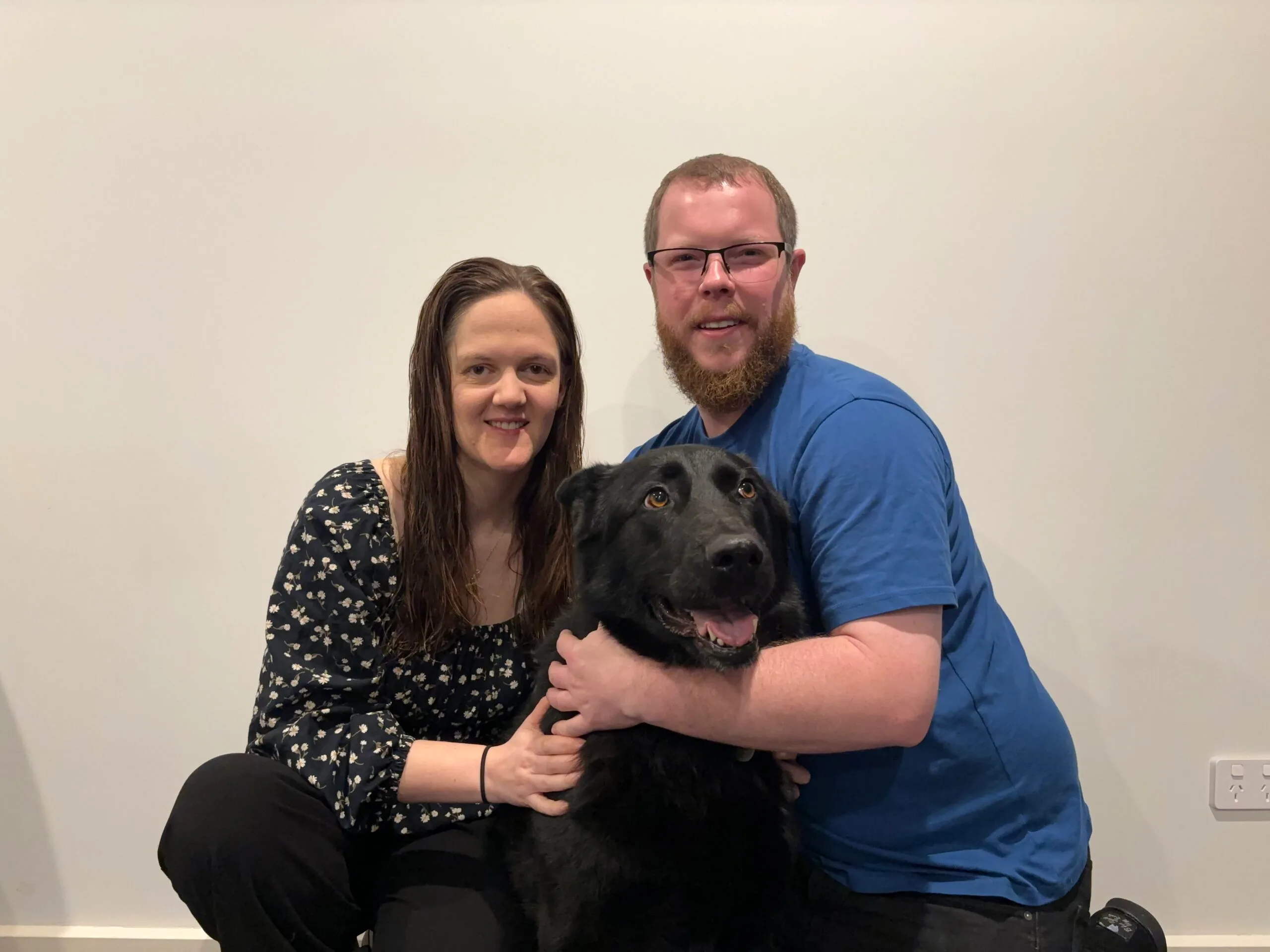 a couple and their dog