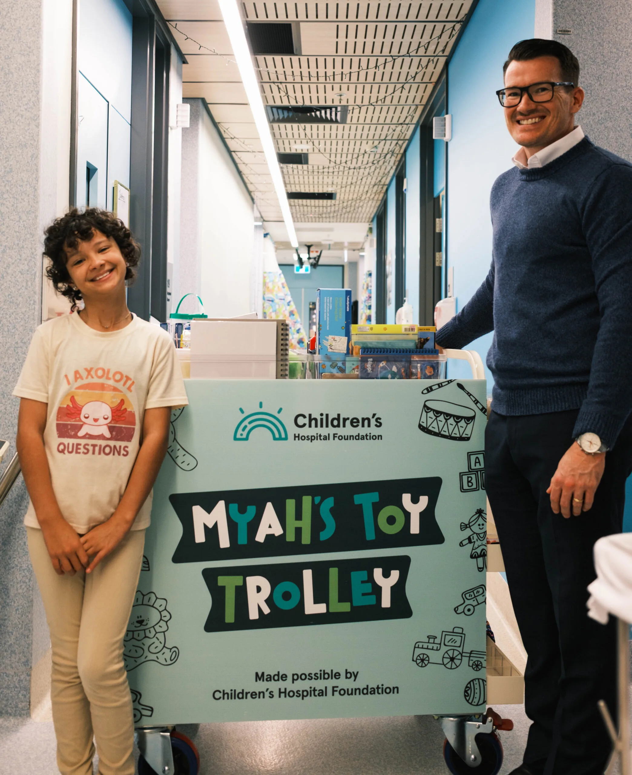 father and daughter with toy trolley