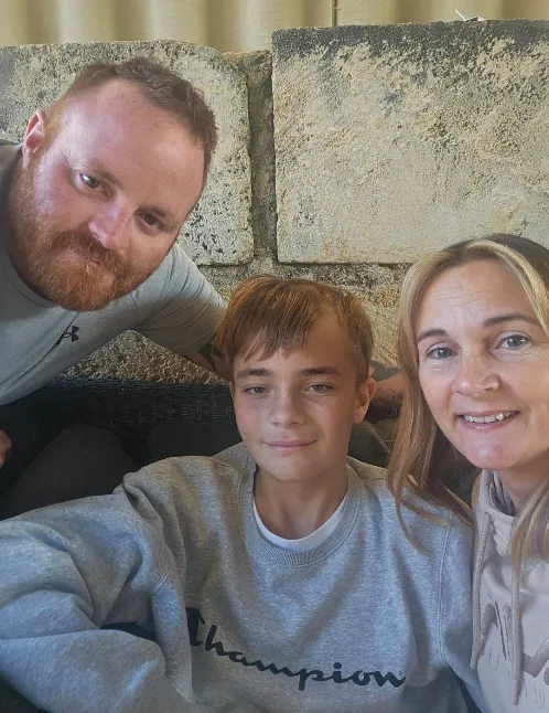Image of mother, father and son recovering from surgery