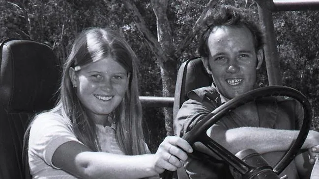 Peta-Lynn and Hilton in the open-air 4WD