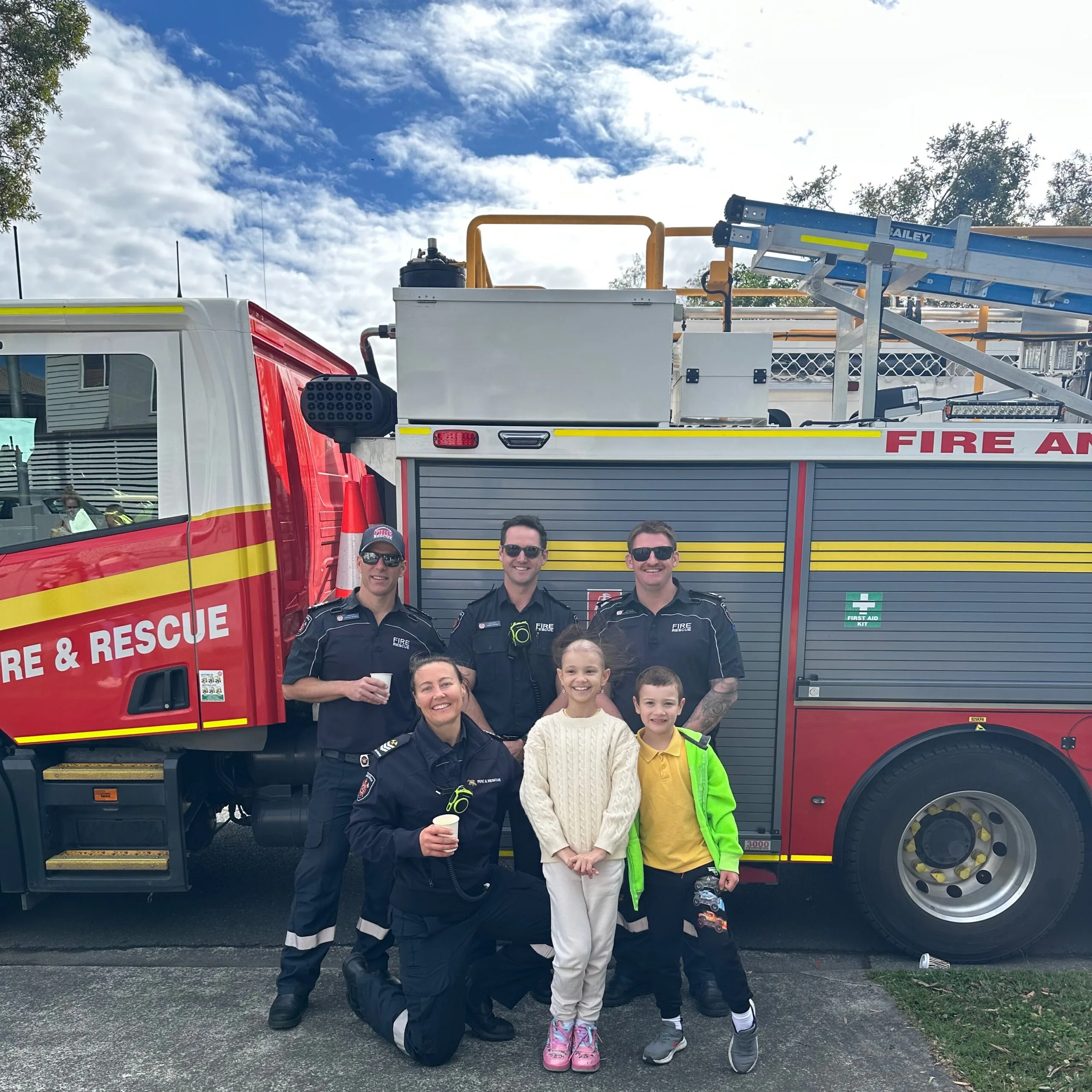 firefighters and young girl