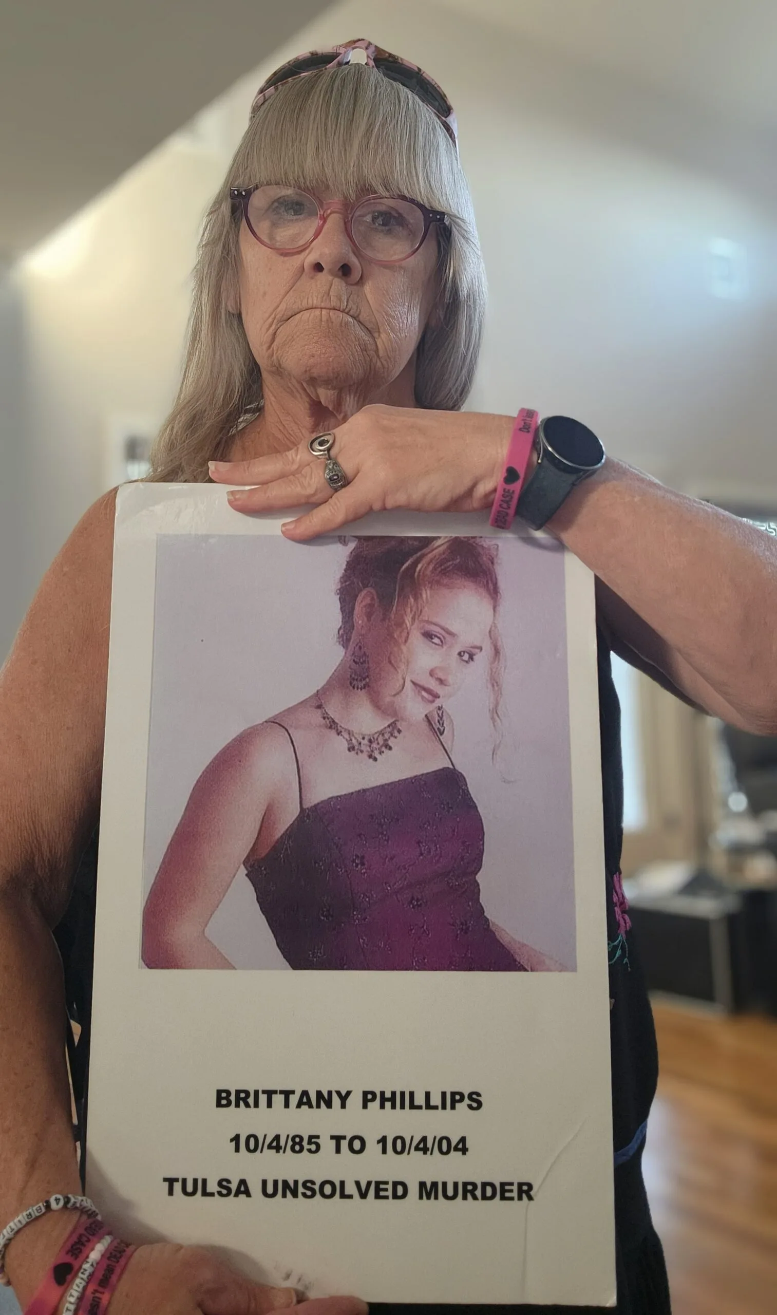 Maggie holding a picture of Brittany