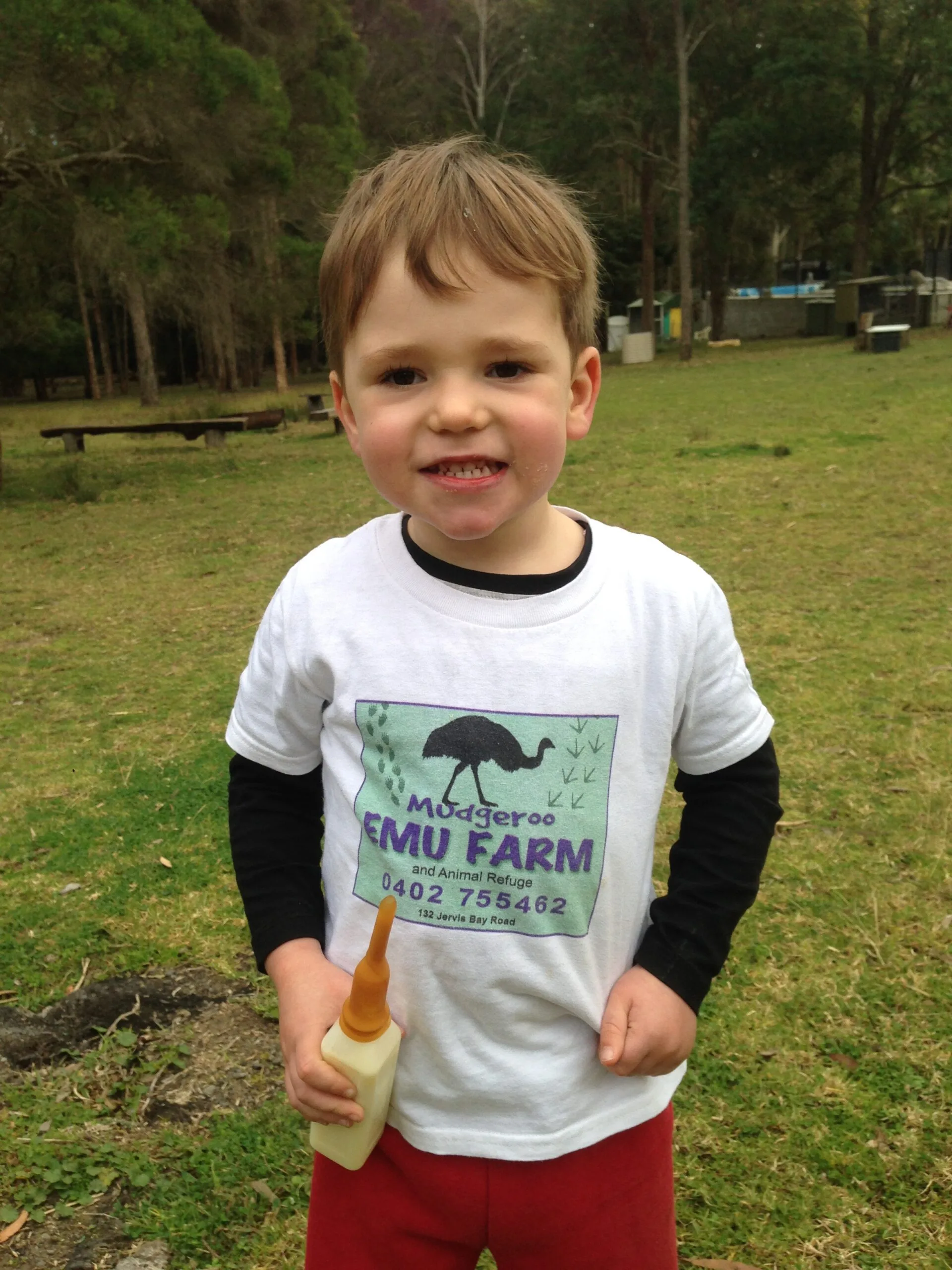 Little boy wearing emu tshirt